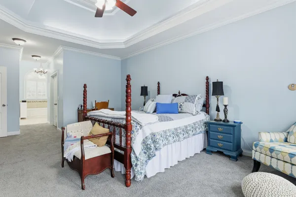 a kitchen with stainless steel appliances granite countertop a refrigerator a sink a stove top oven and white cabinets