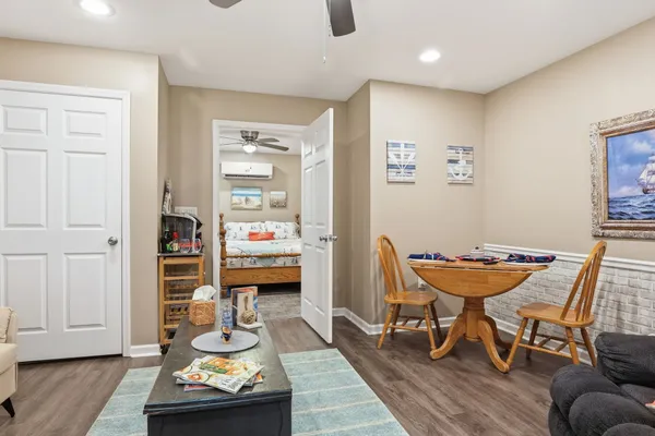 a bathroom with white cabinets and sink