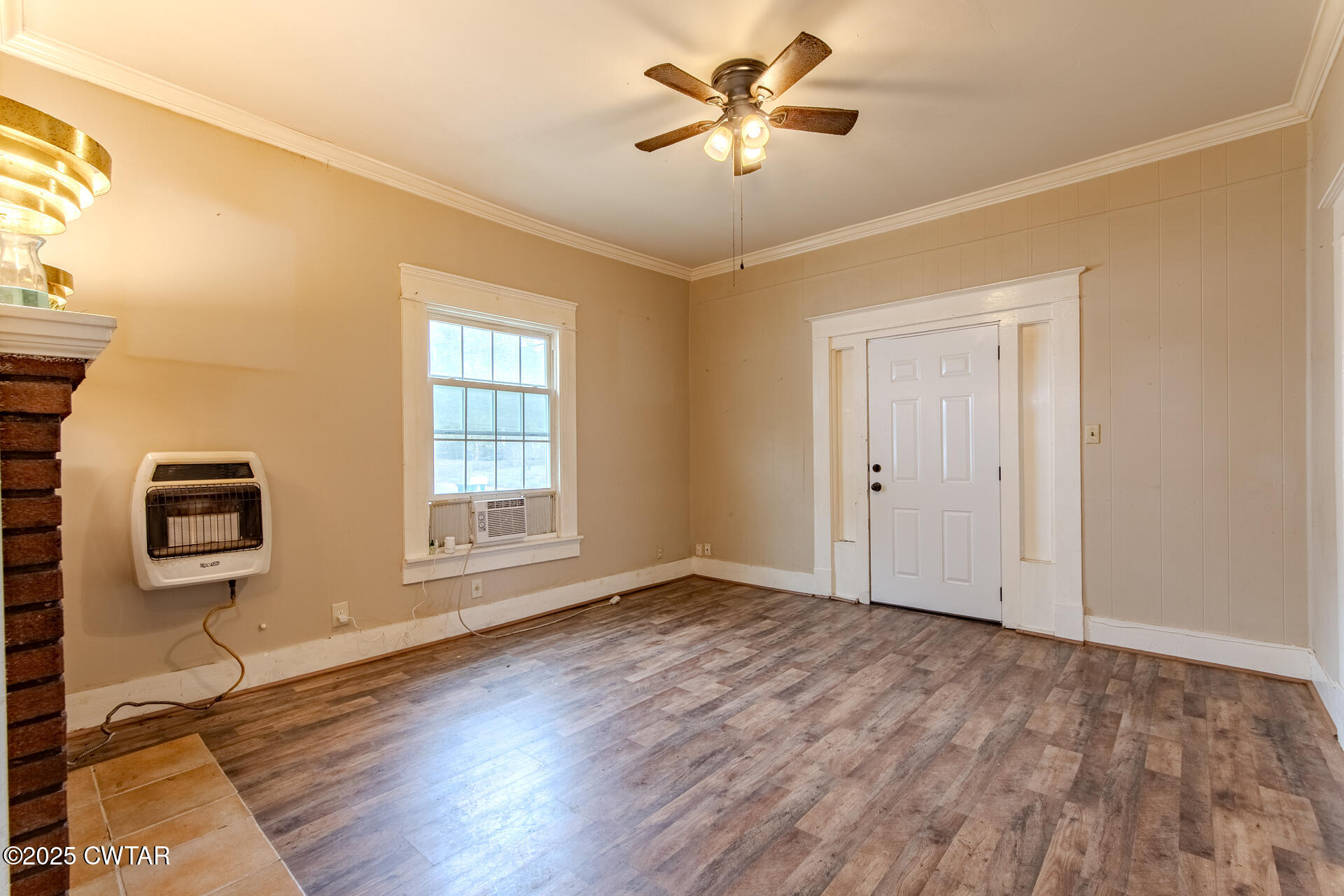 201 North Fairgrounds Street Jackson, TN 38301 - Photo 11 of 27 a view of empty room with wooden floor and fan