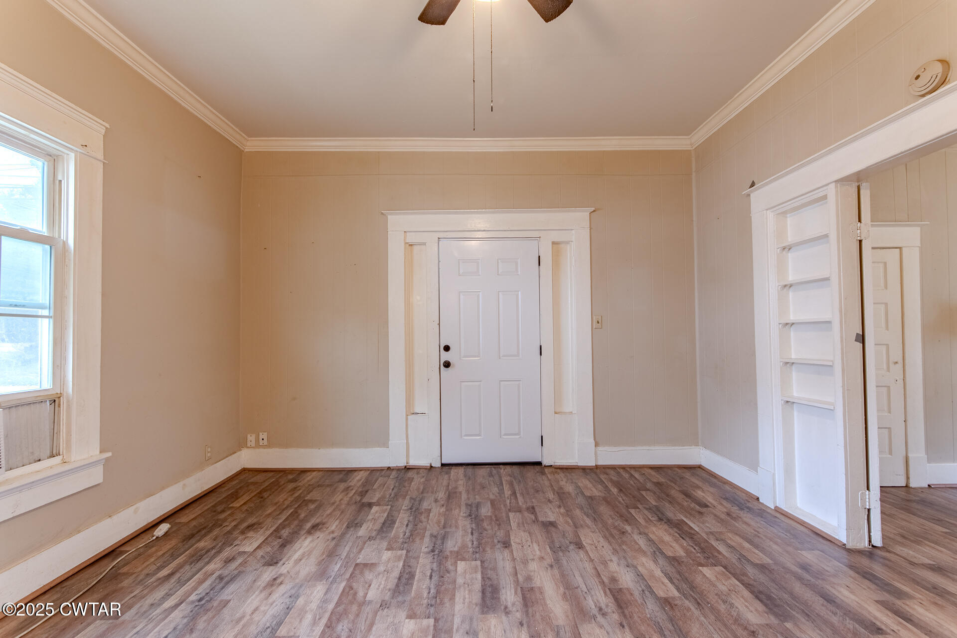 201 North Fairgrounds Street Jackson, TN 38301 - Photo 12 of 27 a view of an empty room with wooden floor and a window