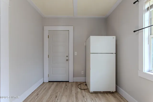 a bathroom with a sink a toilet a mirror and vanity