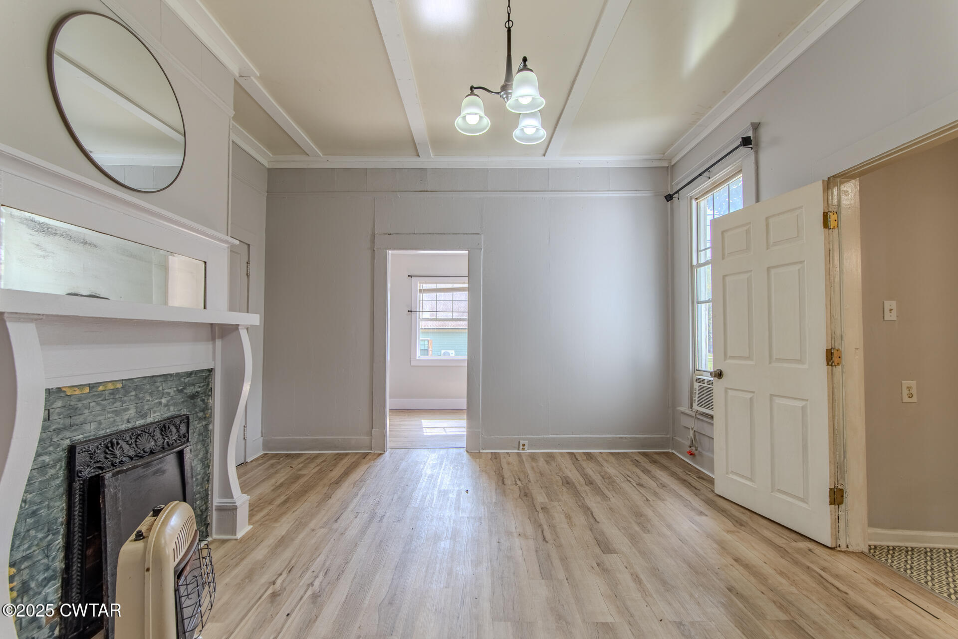 201 North Fairgrounds Street Jackson, TN 38301 - Photo 24 of 27 a view of a livingroom with wooden floor and a fireplace