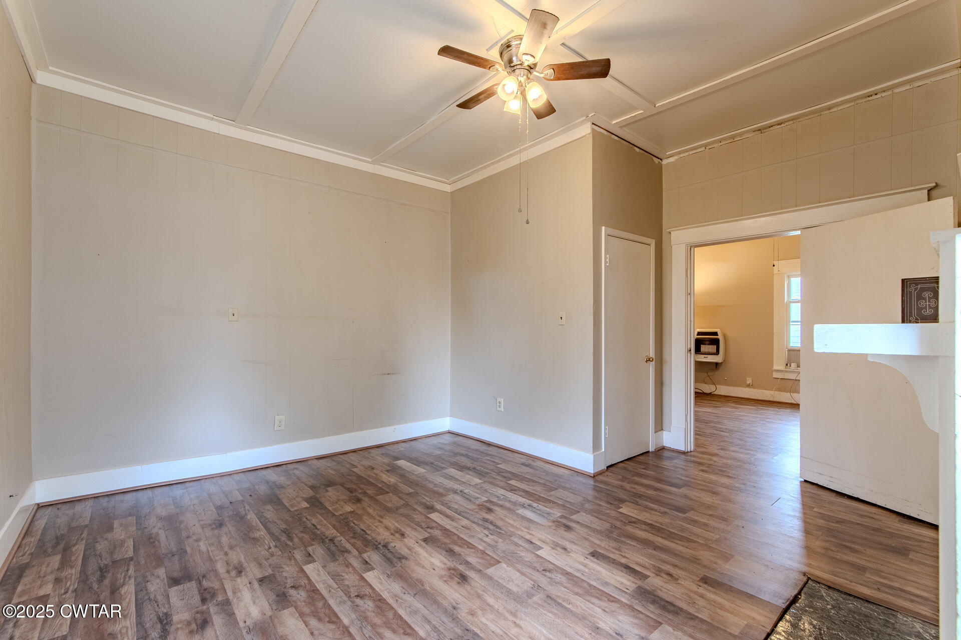 201 North Fairgrounds Street Jackson, TN 38301 - Photo 10 of 27 a view of a livingroom with wooden floor and a ceiling fan