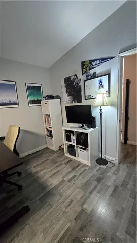 a view of a livingroom with furniture and a flat screen tv