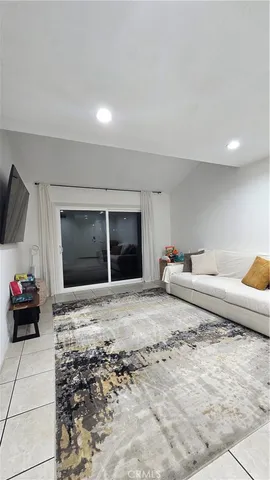 a living room with a couch and a flat screen tv