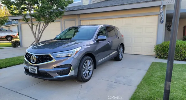 a car parked in front of a house