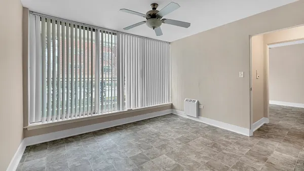 a view of an empty room with a window
