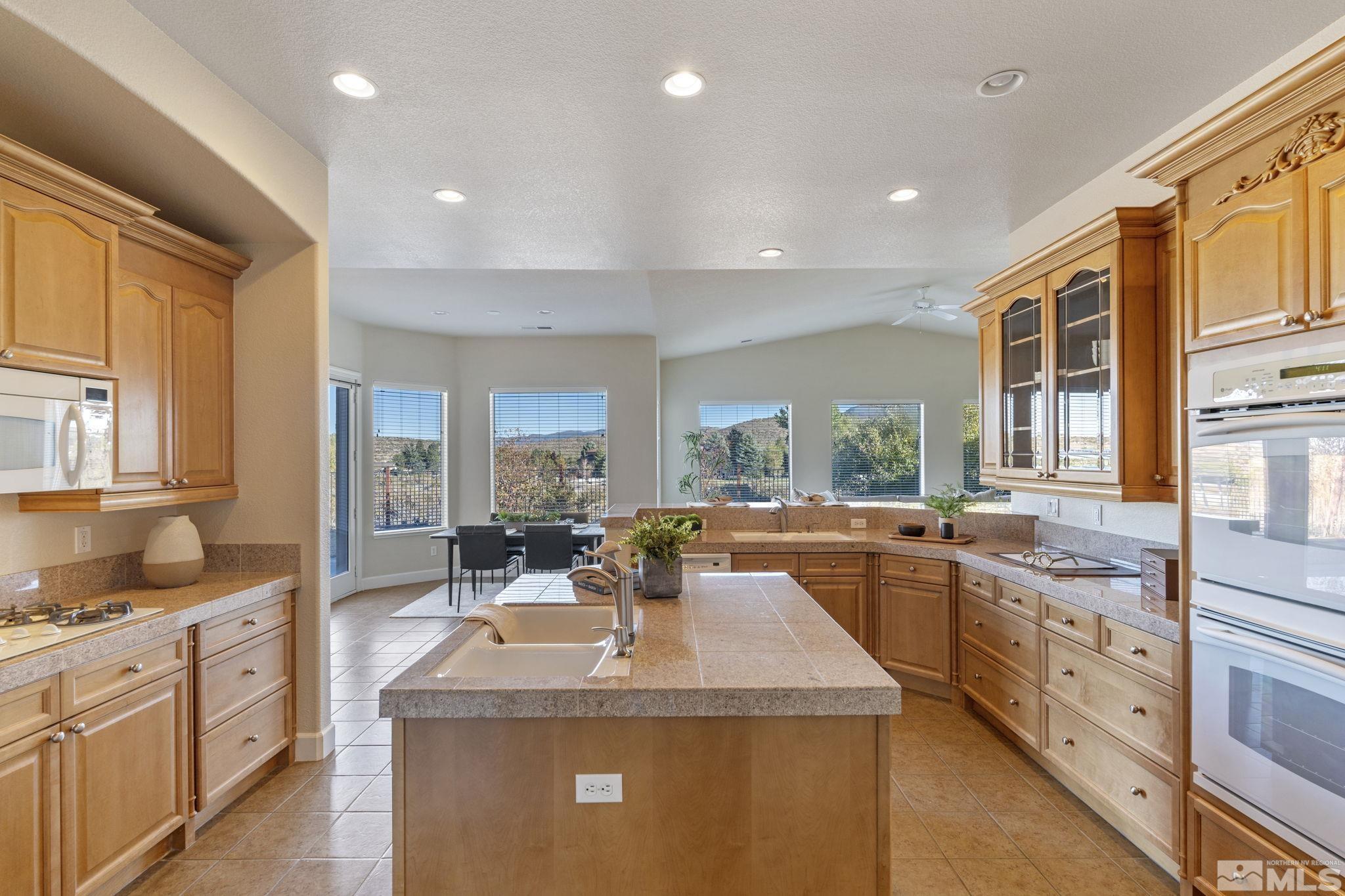 14760 Chateau Avenue Reno, NV 89511 - Photo 13 of 38 a kitchen with sink stove and cabinets