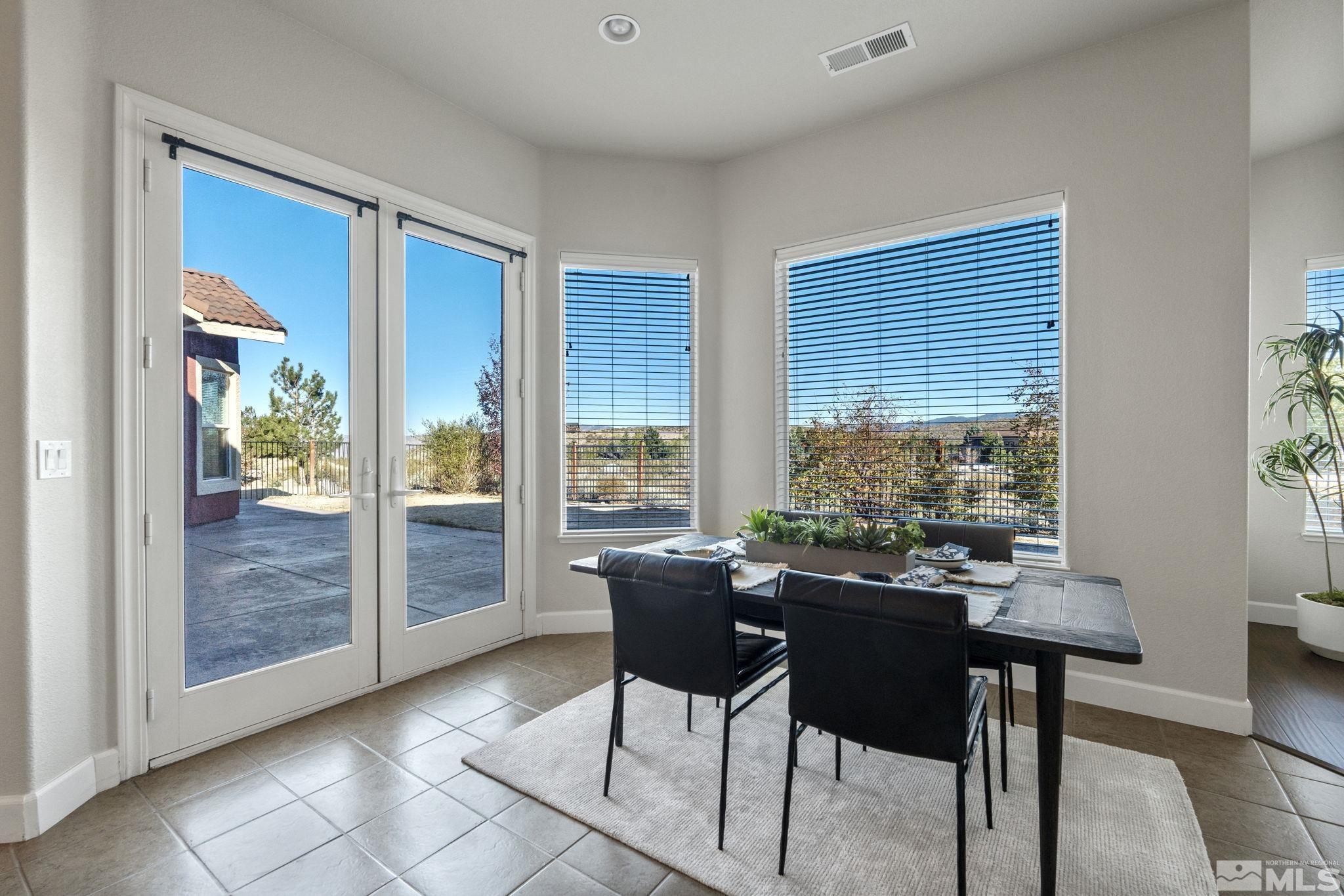 14760 Chateau Avenue Reno, NV 89511 - Photo 19 of 38 a view of a dining room with furniture window and outside view