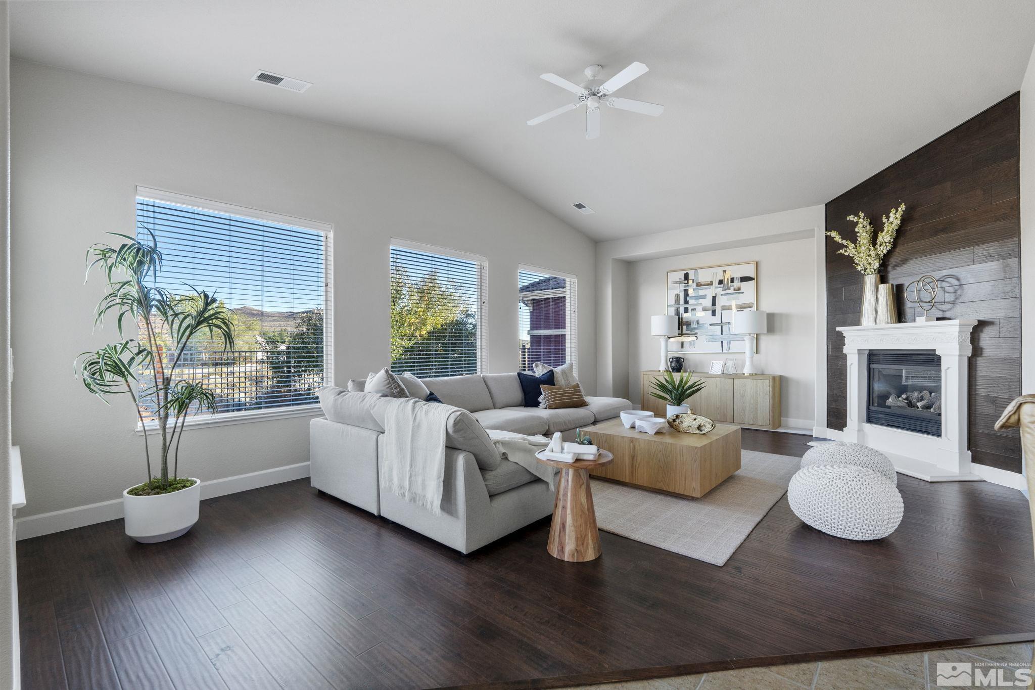 14760 Chateau Avenue Reno, NV 89511 - Photo 20 of 38 a living room with fireplace furniture and a wooden floor