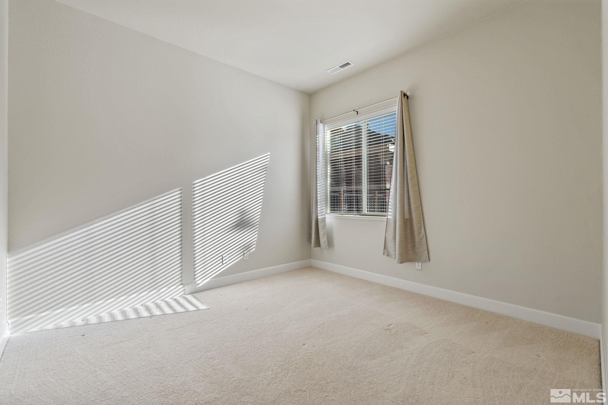14760 Chateau Avenue Reno, NV 89511 - Photo 34 of 38 a view of an empty room with a window