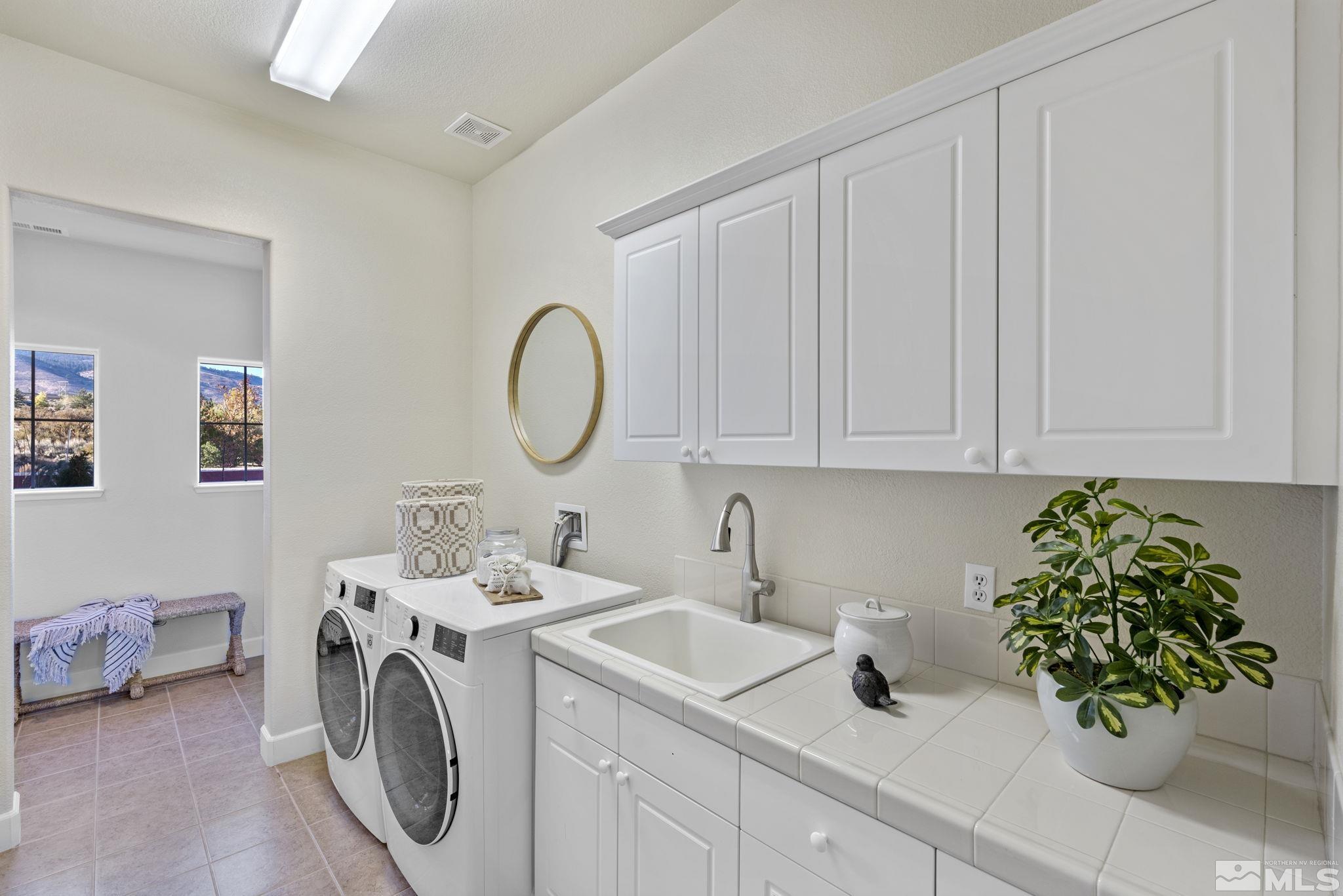 14760 Chateau Avenue Reno, NV 89511 - Photo 35 of 38 a utility room with sink dryer and washer