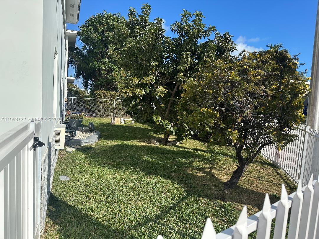 7115 Rue Granville, Unit D Miami Beach, FL 33141 - Photo 13 of 13 a view of backyard of green space