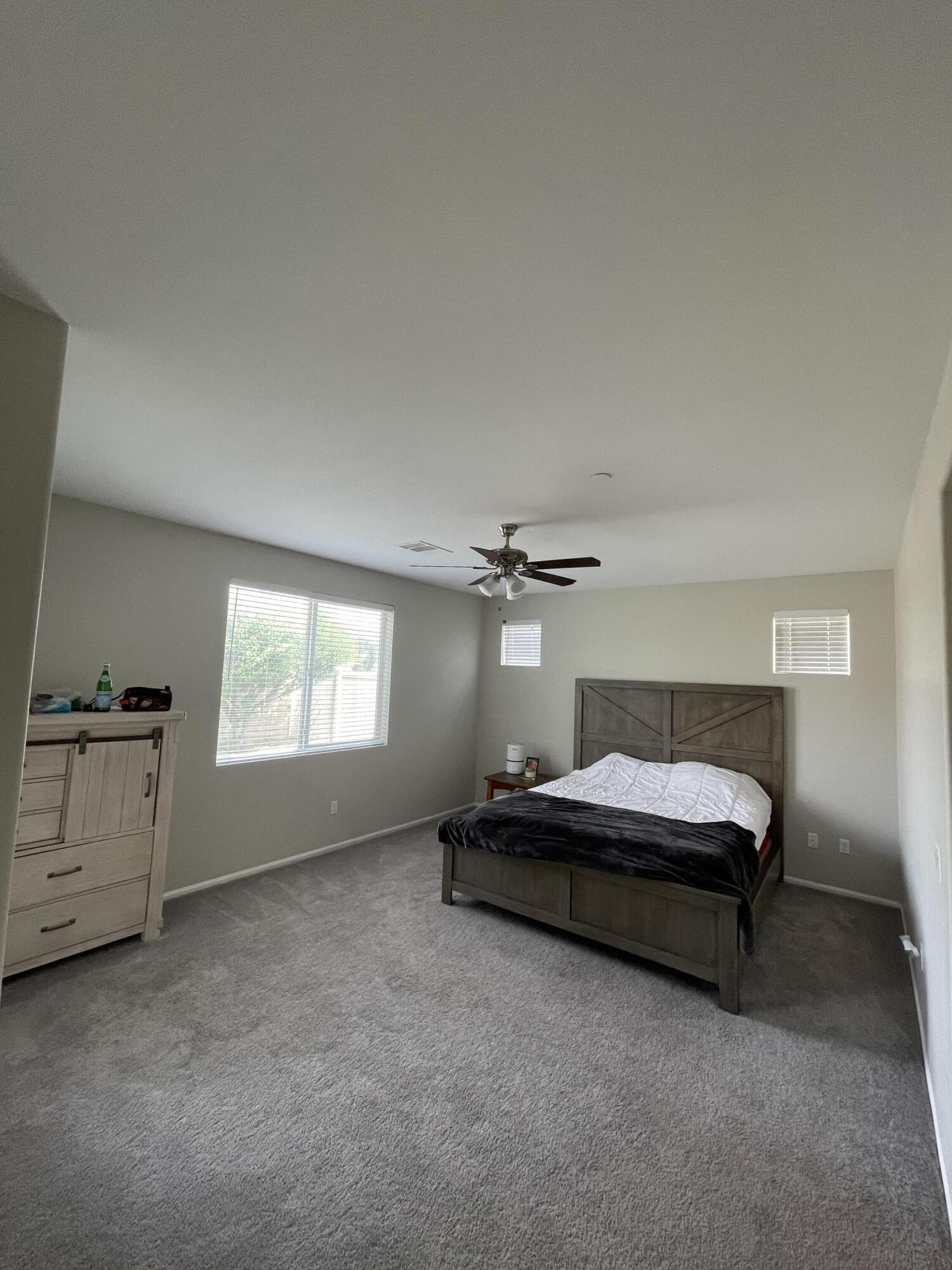 82798 Longfellow Court Indio, CA 92201 - Photo 12 of 15 a spacious bedroom with a bed and window
