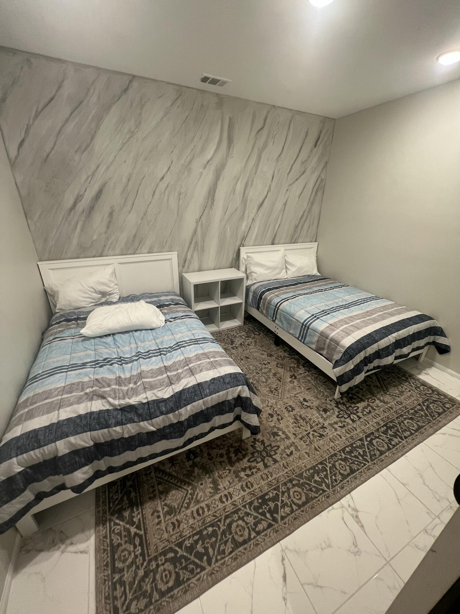 82798 Longfellow Court Indio, CA 92201 - Photo 13 of 15 a bedroom with two beds and a table