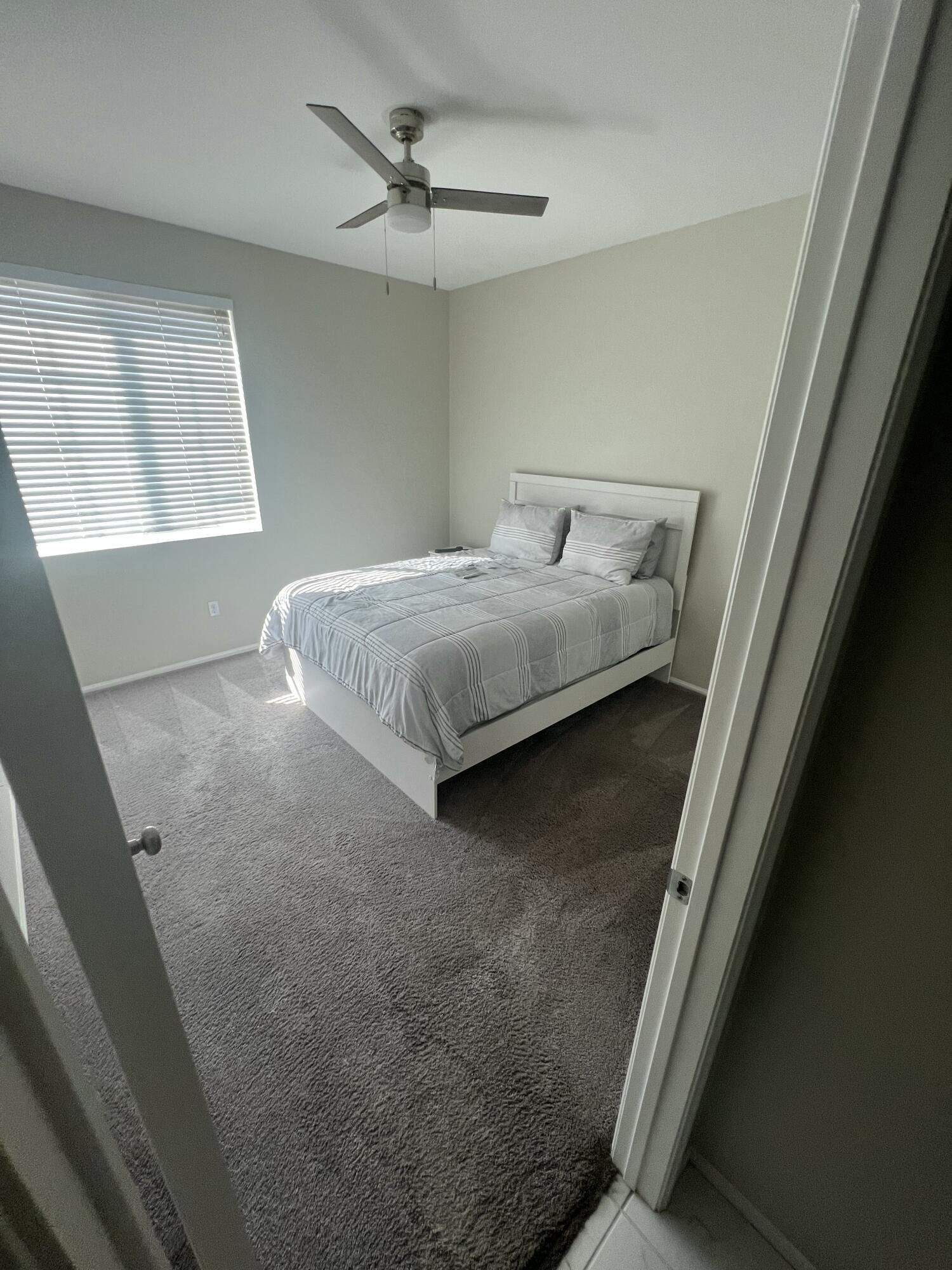 82798 Longfellow Court Indio, CA 92201 - Photo 14 of 15 a bedroom with a bed and window