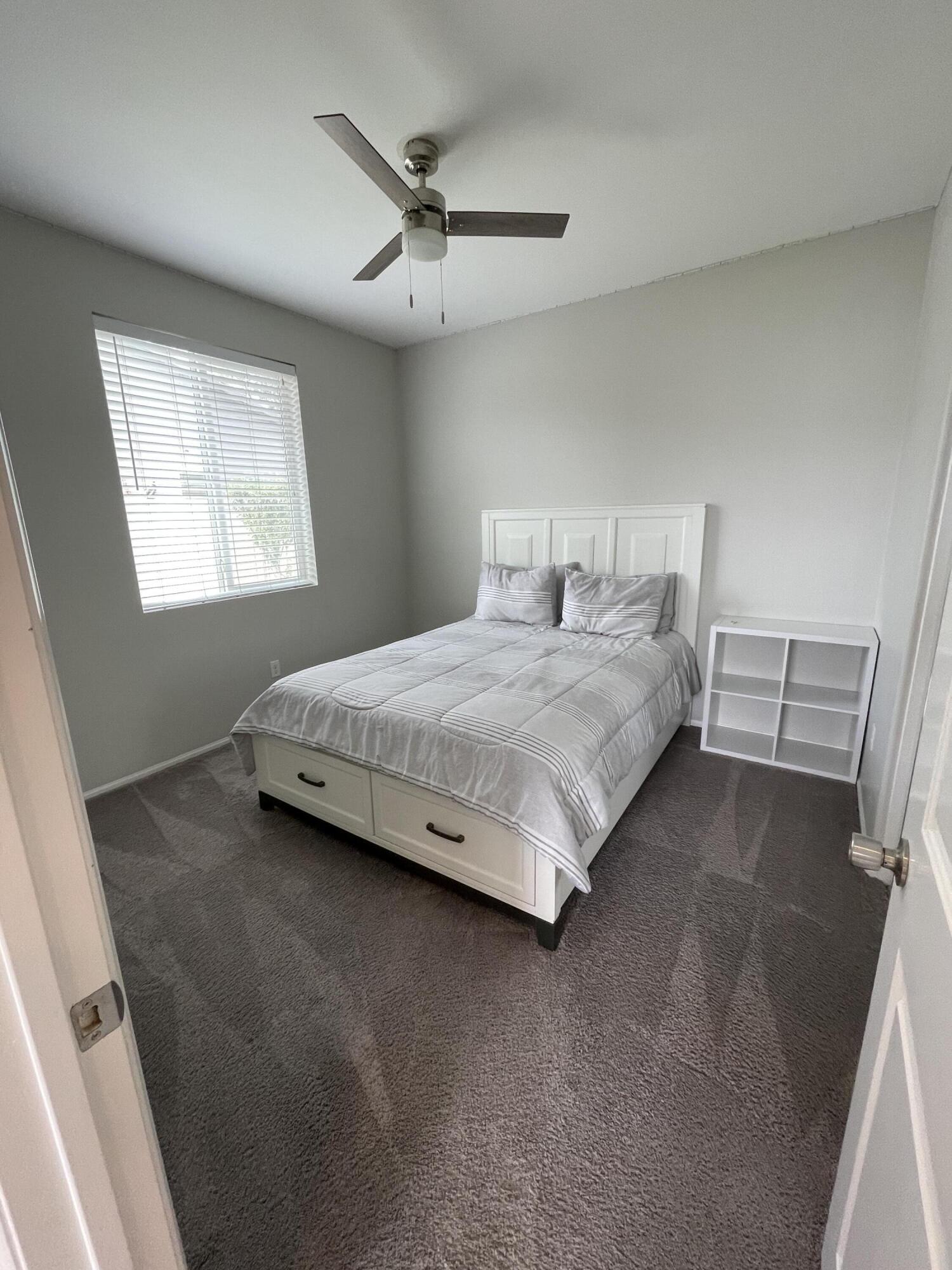 82798 Longfellow Court Indio, CA 92201 - Photo 3 of 15 a bedroom with a bed and window