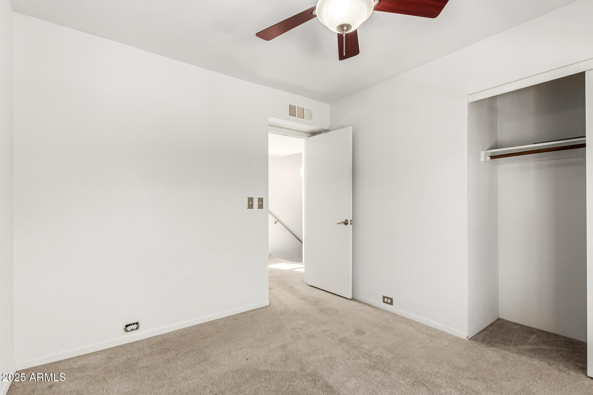 8445 South 48th Street, Unit 2 Phoenix, AZ 85044 - Photo 19 of 32 an empty room with a ceiling fan and a window