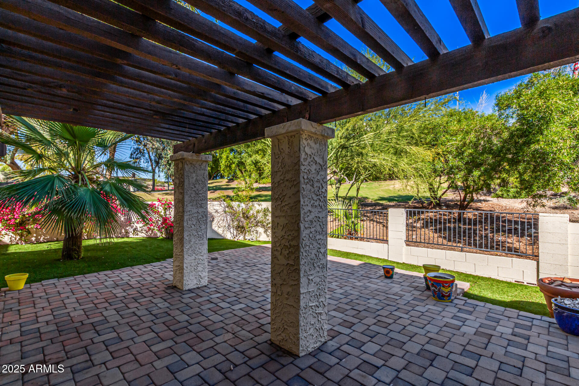 8445 South 48th Street, Unit 2 Phoenix, AZ 85044 - Photo 23 of 32 a small garden covered with tall trees