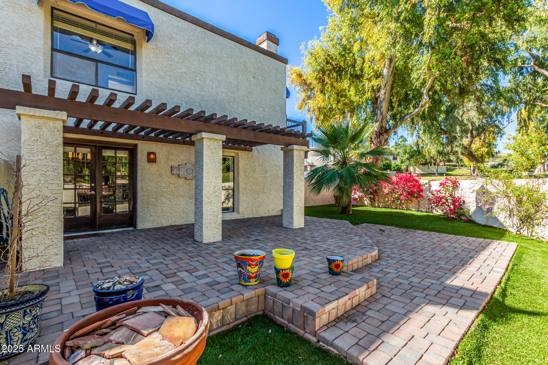 8445 South 48th Street, Unit 2 Phoenix, AZ 85044 - Photo 24 of 32 a view of a backyard with plants and patio