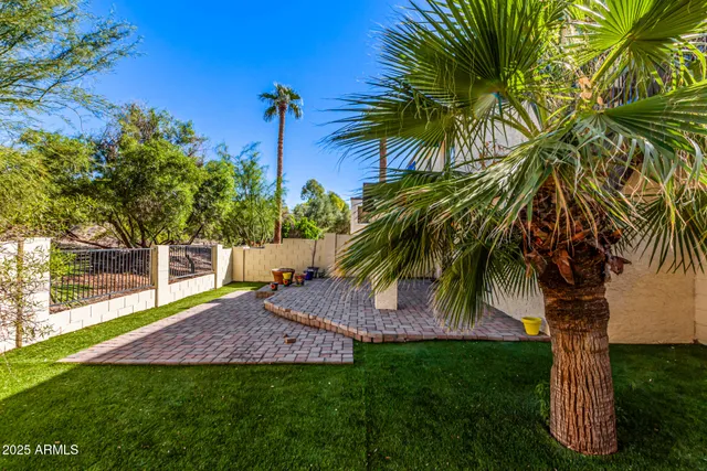 a view of outdoor space with a garden and trees