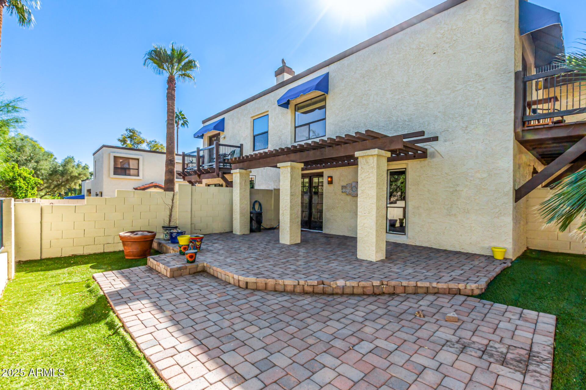 8445 South 48th Street, Unit 2 Phoenix, AZ 85044 - Photo 26 of 32 a front view of a house with garden
