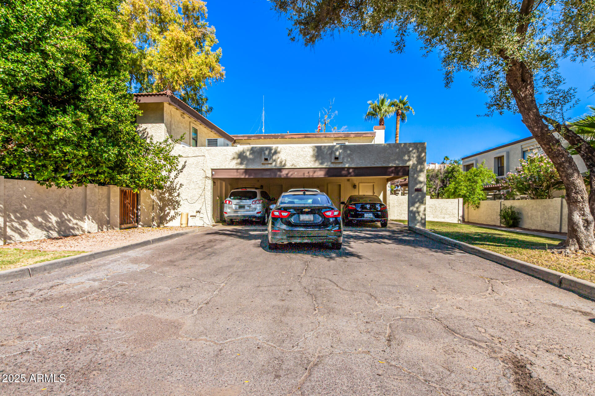 8445 South 48th Street, Unit 2 Phoenix, AZ 85044 - Photo 27 of 32 a car parked in front of a house