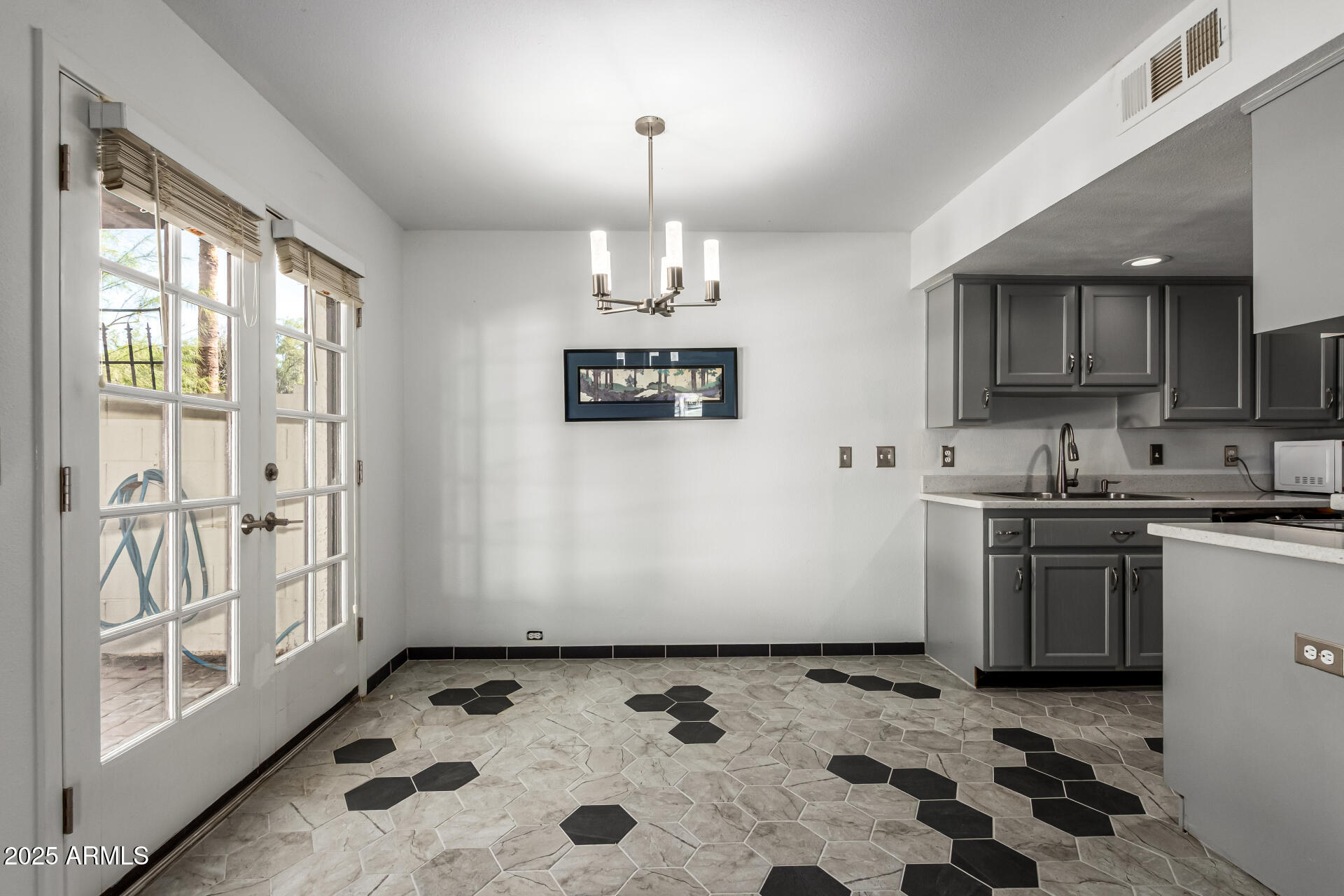 8445 South 48th Street, Unit 2 Phoenix, AZ 85044 - Photo 8 of 32 a kitchen with stainless steel appliances granite countertop a stove a sink and a refrigerator