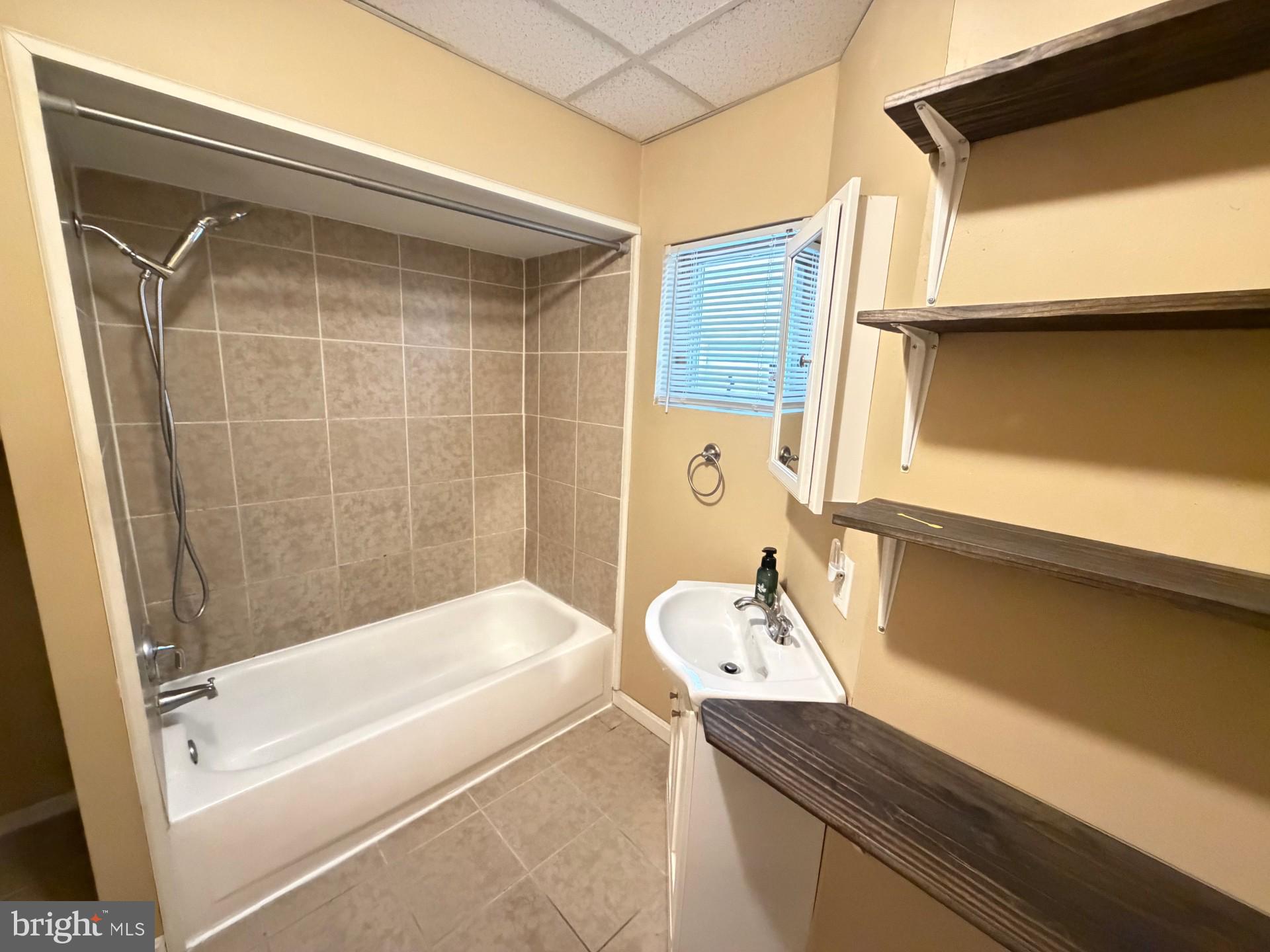 226 West Ridge Street Coaldale, PA 18218 - Photo 23 of 33 a bathroom with a granite countertop sink a toilet and bathtub