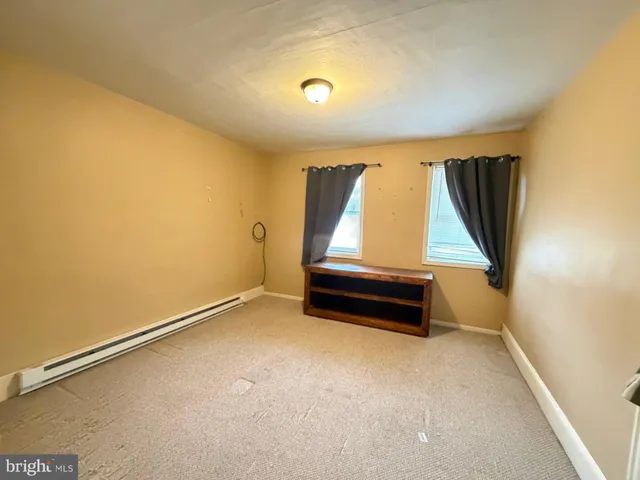 a view of room with stairs and a window