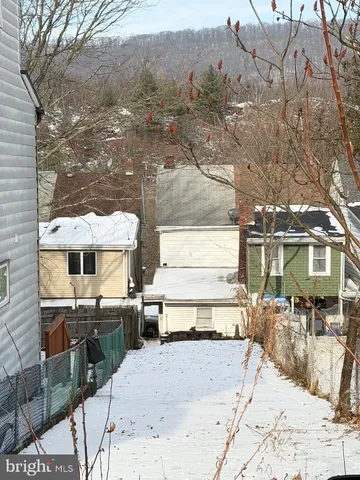 a view of a backyard with a sitting area