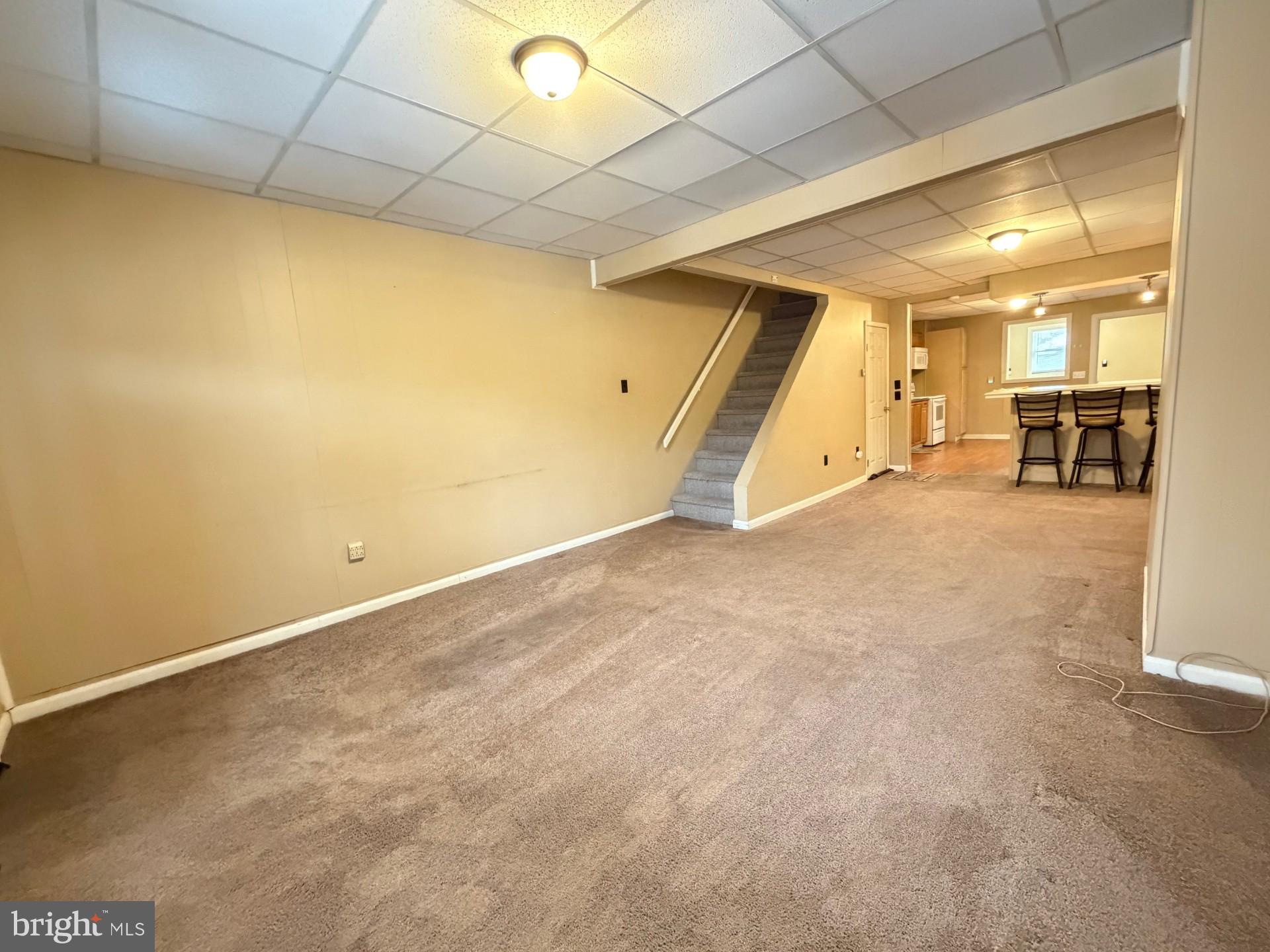 226 West Ridge Street Coaldale, PA 18218 - Photo 6 of 33 an empty room with wooden floor and windows