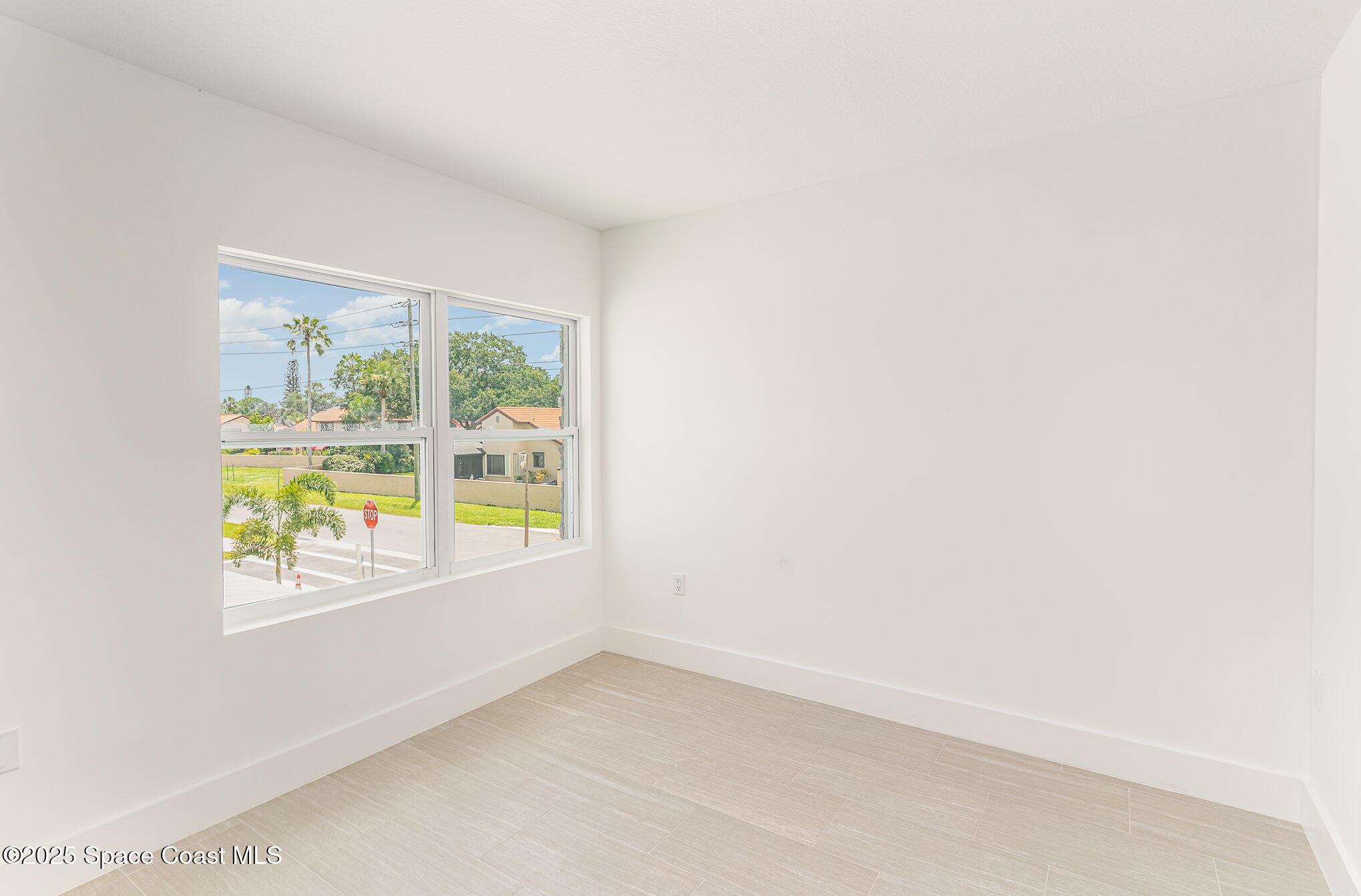 1635 Par Street Northeast, Unit 2202 Palm Bay, FL 32905 - Photo 13 of 45 a view of an empty room with a window