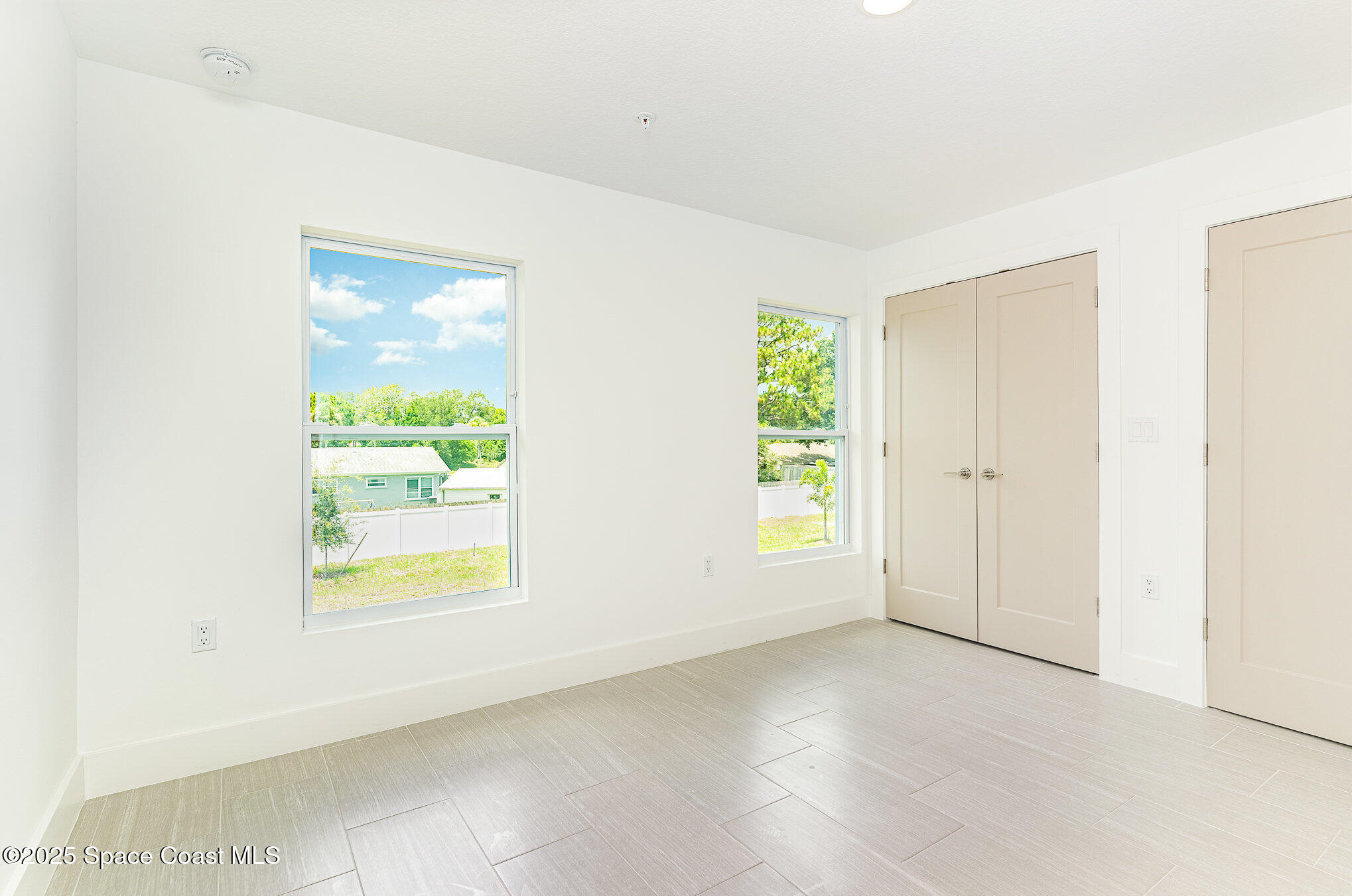 1635 Par Street Northeast, Unit 2202 Palm Bay, FL 32905 - Photo 18 of 45 an empty room with windows