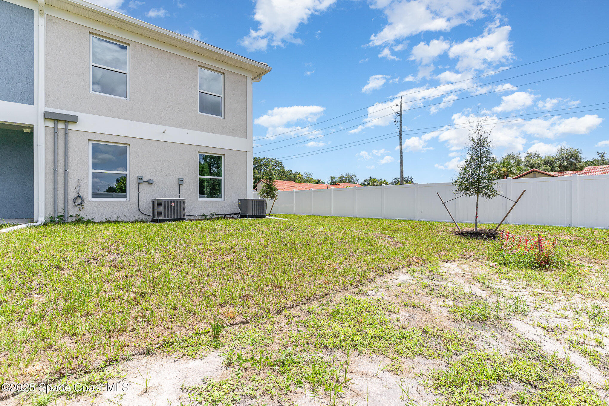 1635 Par Street Northeast, Unit 2202 Palm Bay, FL 32905 - Photo 32 of 45 a view of an house with backyard and garden