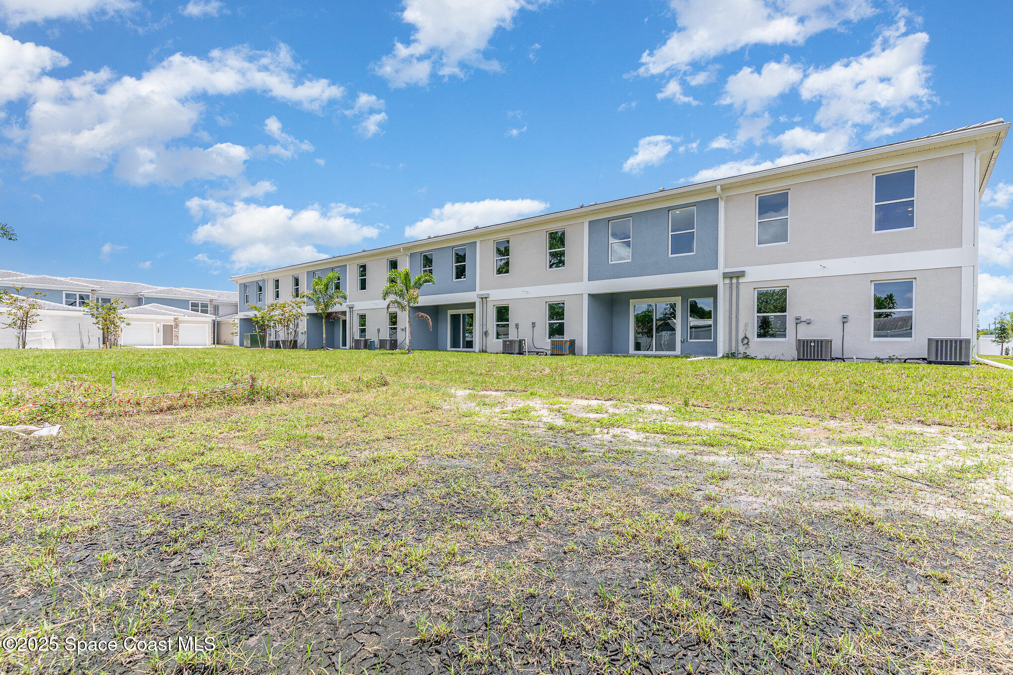 1635 Par Street Northeast, Unit 2202 Palm Bay, FL 32905 - Photo 33 of 45 a view of an ocean with a big yard and large tree