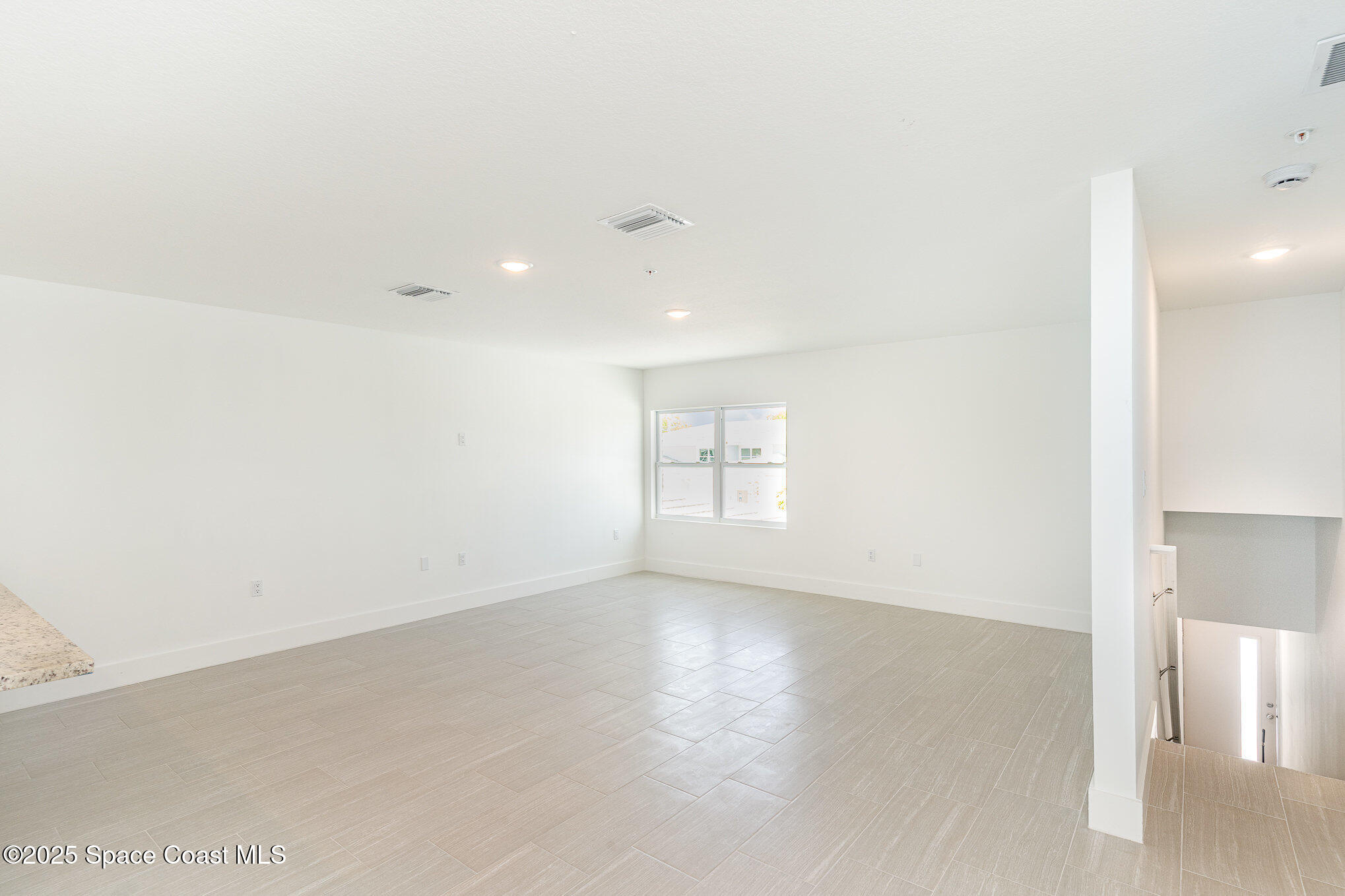 1635 Par Street Northeast, Unit 2202 Palm Bay, FL 32905 - Photo 3 of 45 an empty room with windows and entrance