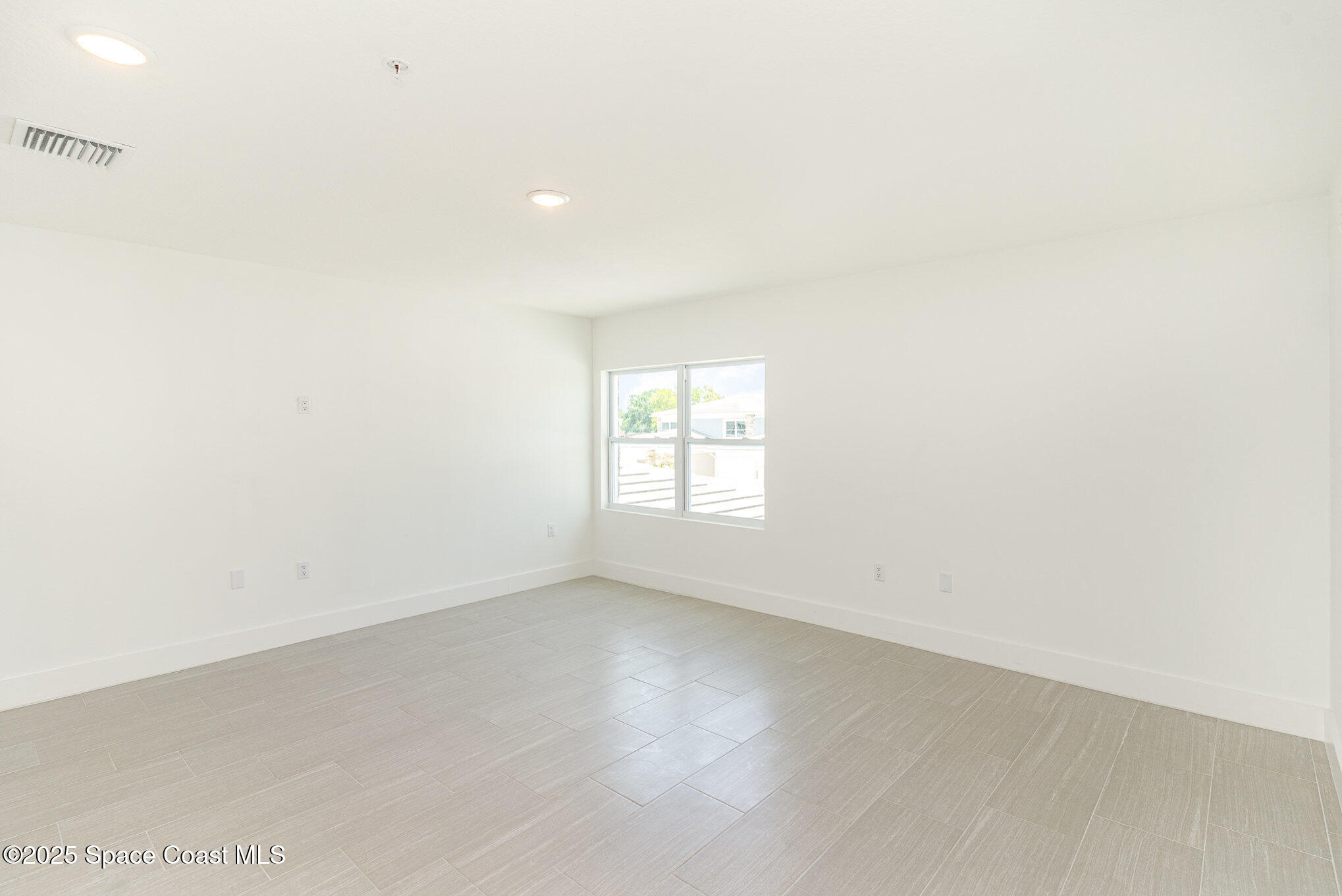 1635 Par Street Northeast, Unit 2202 Palm Bay, FL 32905 - Photo 5 of 45 an empty room with a window