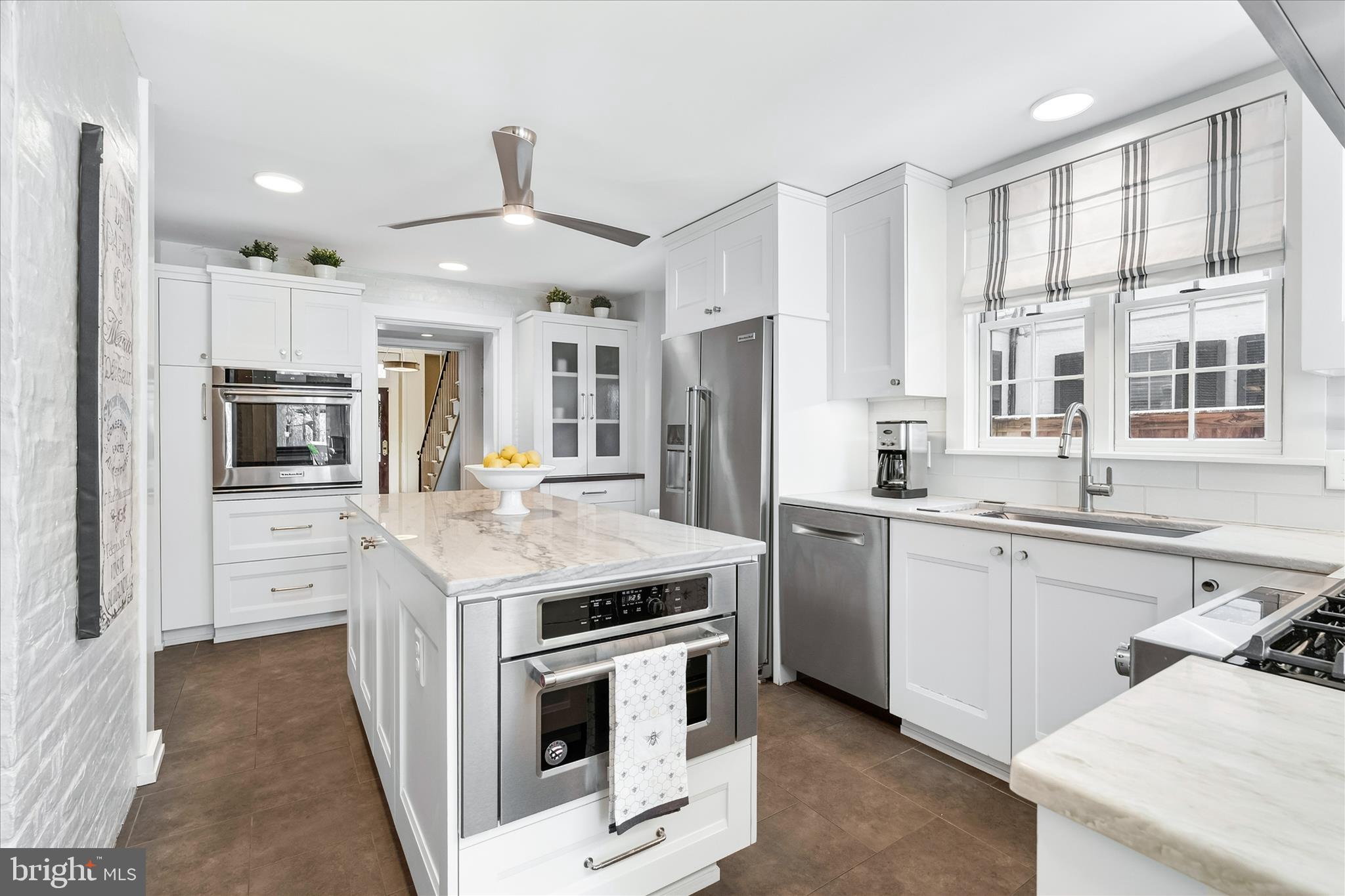 225 East 2nd Street Frederick, MD 21701 - Photo 21 of 125 a kitchen that has a lot of white cabinets and stainless steel appliances