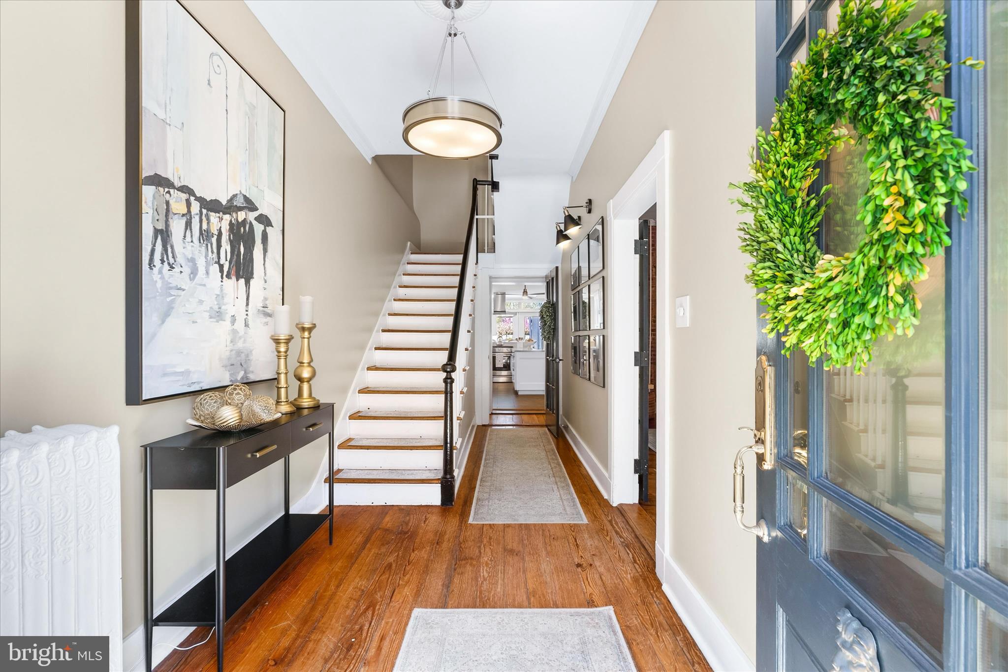 225 East 2nd Street Frederick, MD 21701 - Photo 5 of 125 a view of a hallway with wooden floor and staircase