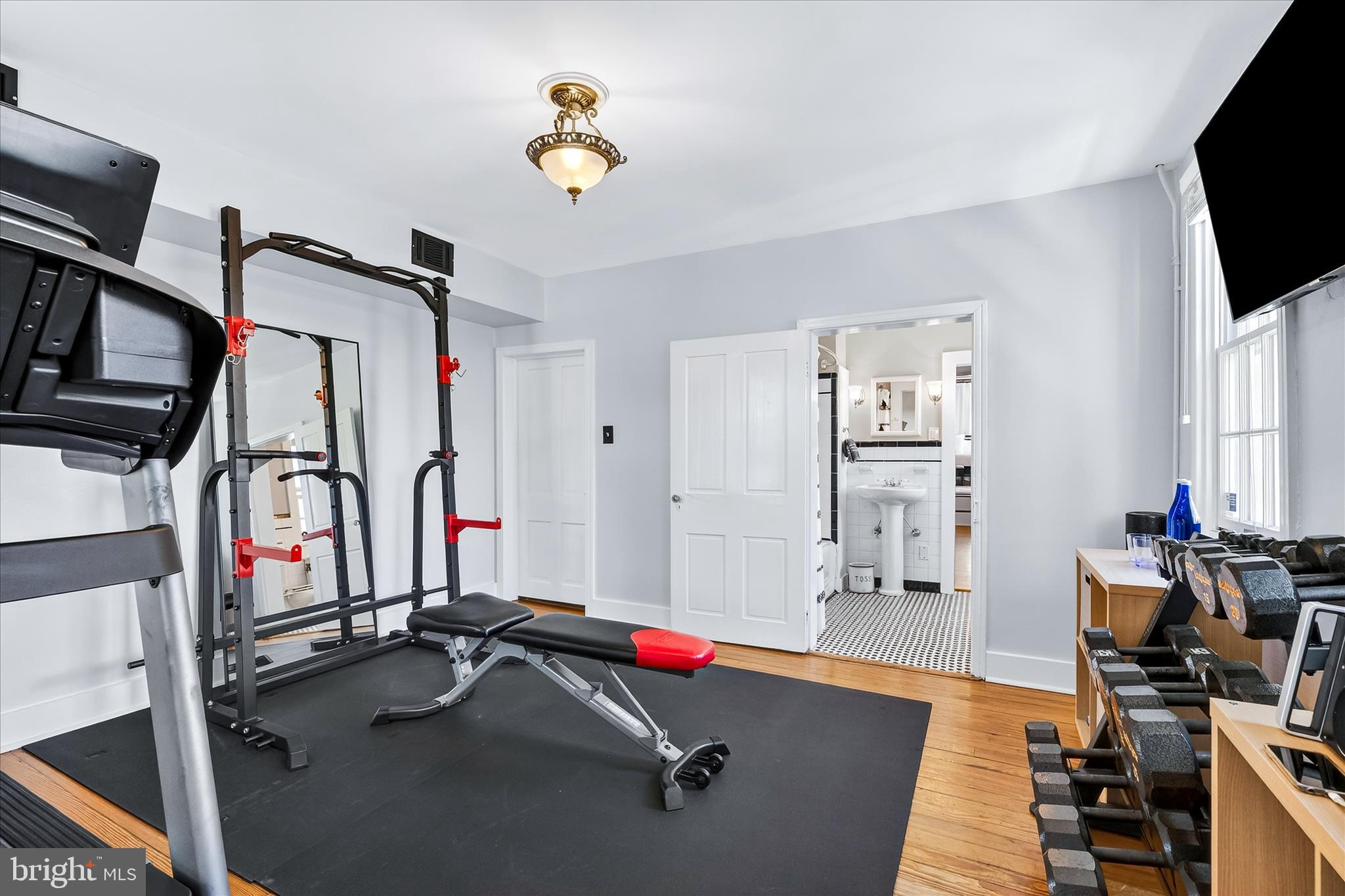 225 East 2nd Street Frederick, MD 21701 - Photo 52 of 125 a room with gym equipment and flat screen tv