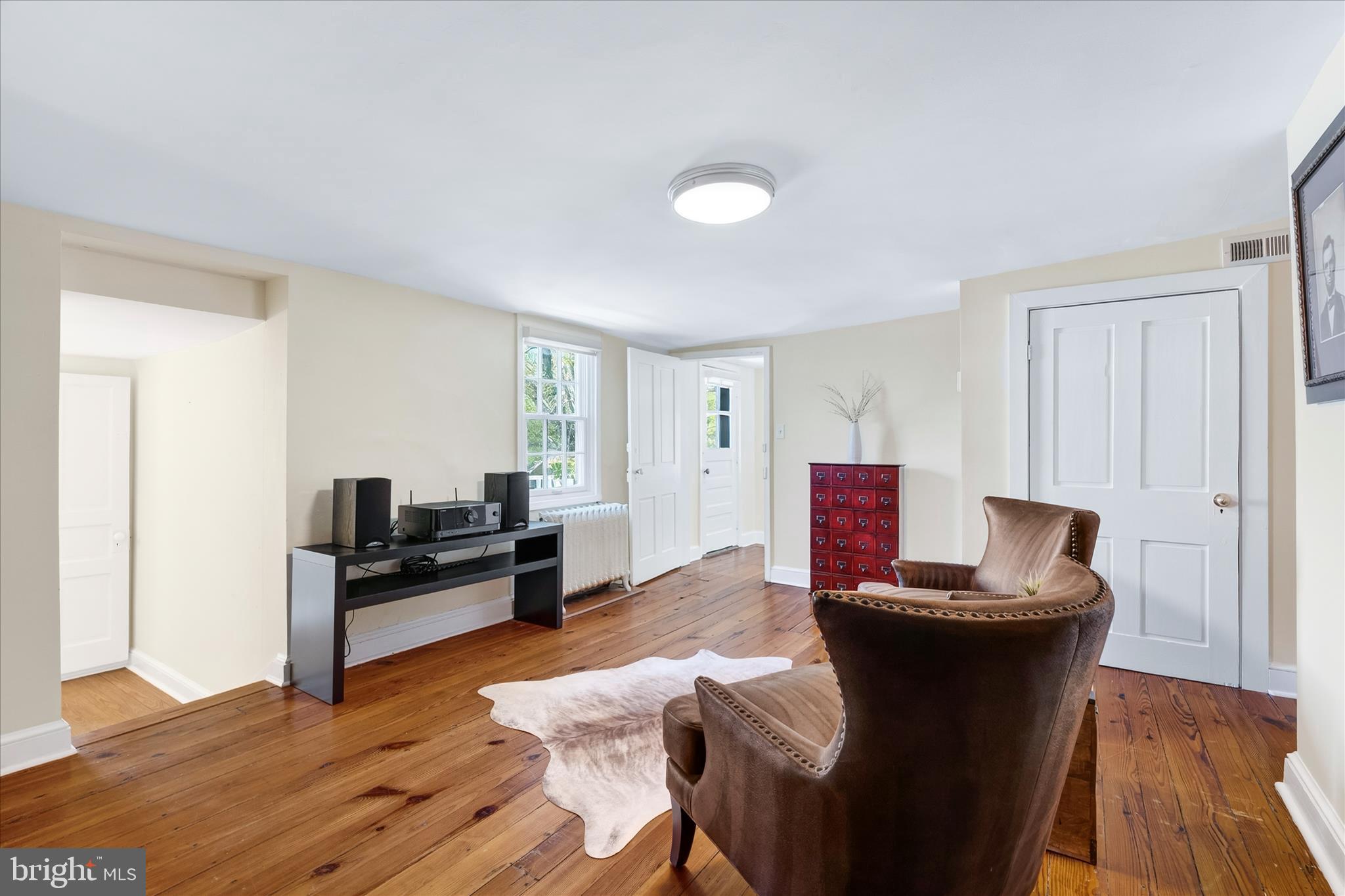 225 East 2nd Street Frederick, MD 21701 - Photo 57 of 125 a living room with furniture and a wooden floor