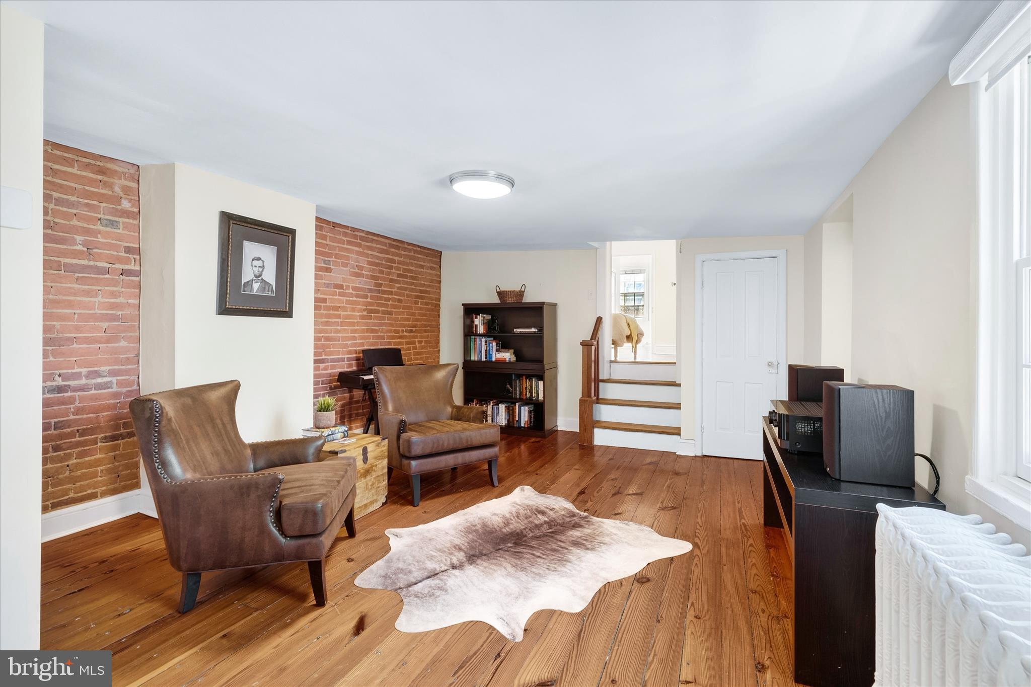 225 East 2nd Street Frederick, MD 21701 - Photo 58 of 125 a living room with furniture and a wooden floor