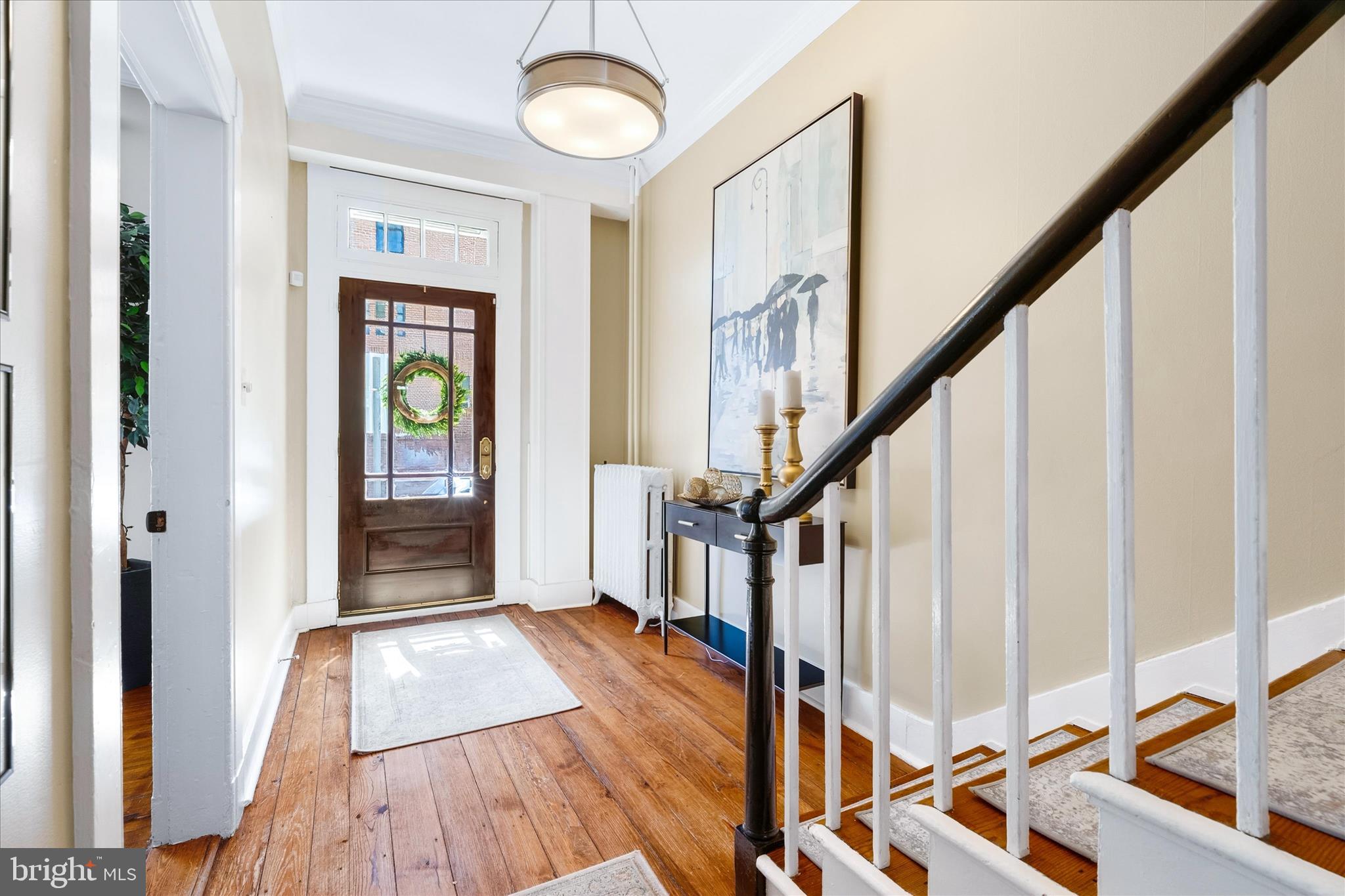225 East 2nd Street Frederick, MD 21701 - Photo 6 of 125 a view of an entryway with wooden floor and stairs