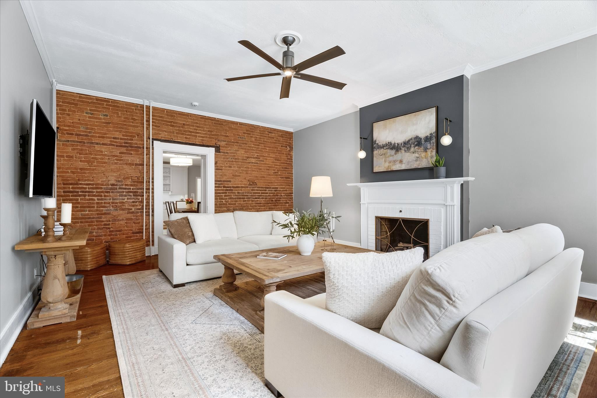 225 East 2nd Street Frederick, MD 21701 - Photo 8 of 125 a living room with furniture and a fireplace