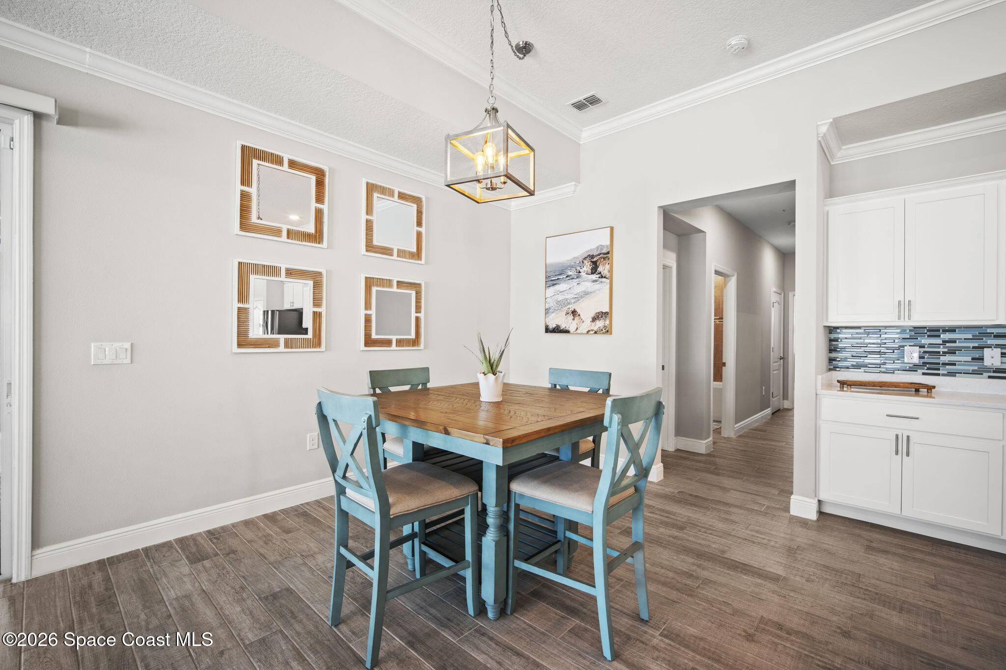 4835 Hebron Drive Merritt Island, FL 32953 - Photo 21 of 53 a view of a dining room with furniture window and wooden floor