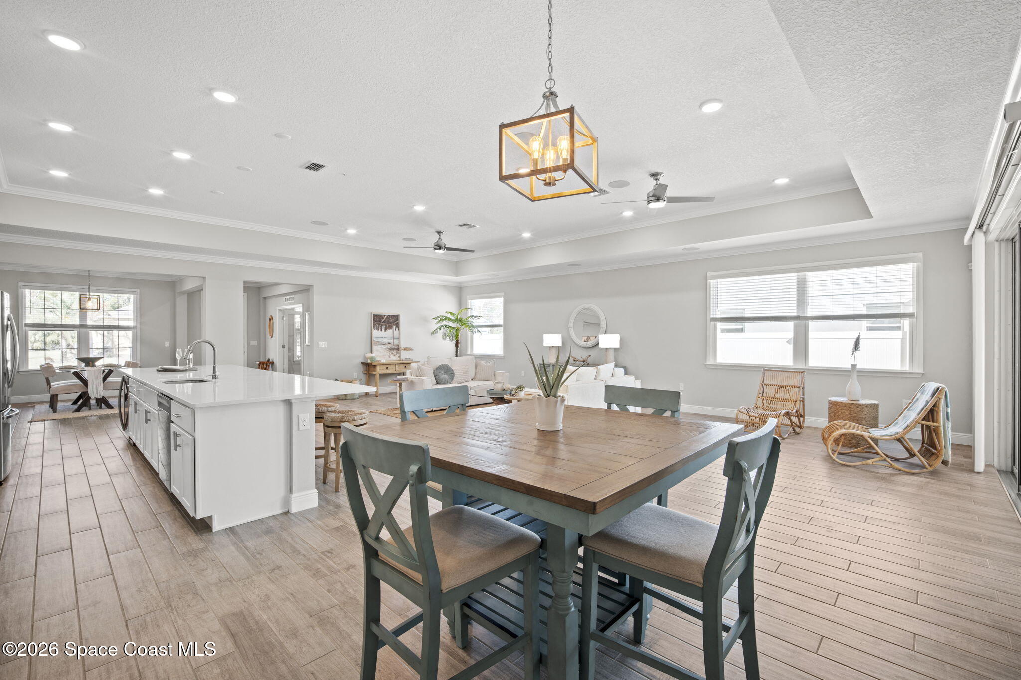 4835 Hebron Drive Merritt Island, FL 32953 - Photo 22 of 53 a view of a dining room with furniture and wooden floor