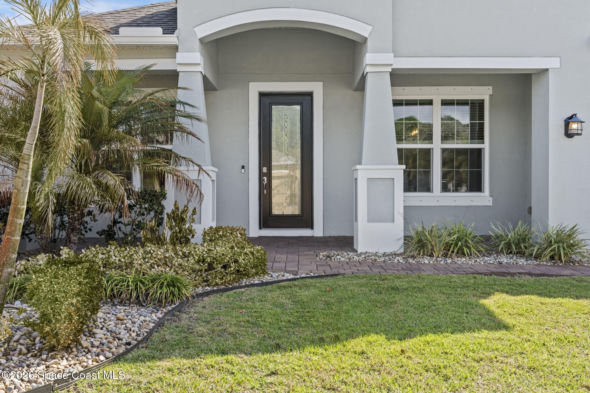 4835 Hebron Drive Merritt Island, FL 32953 - Photo 4 of 53 front view of a house with a yard