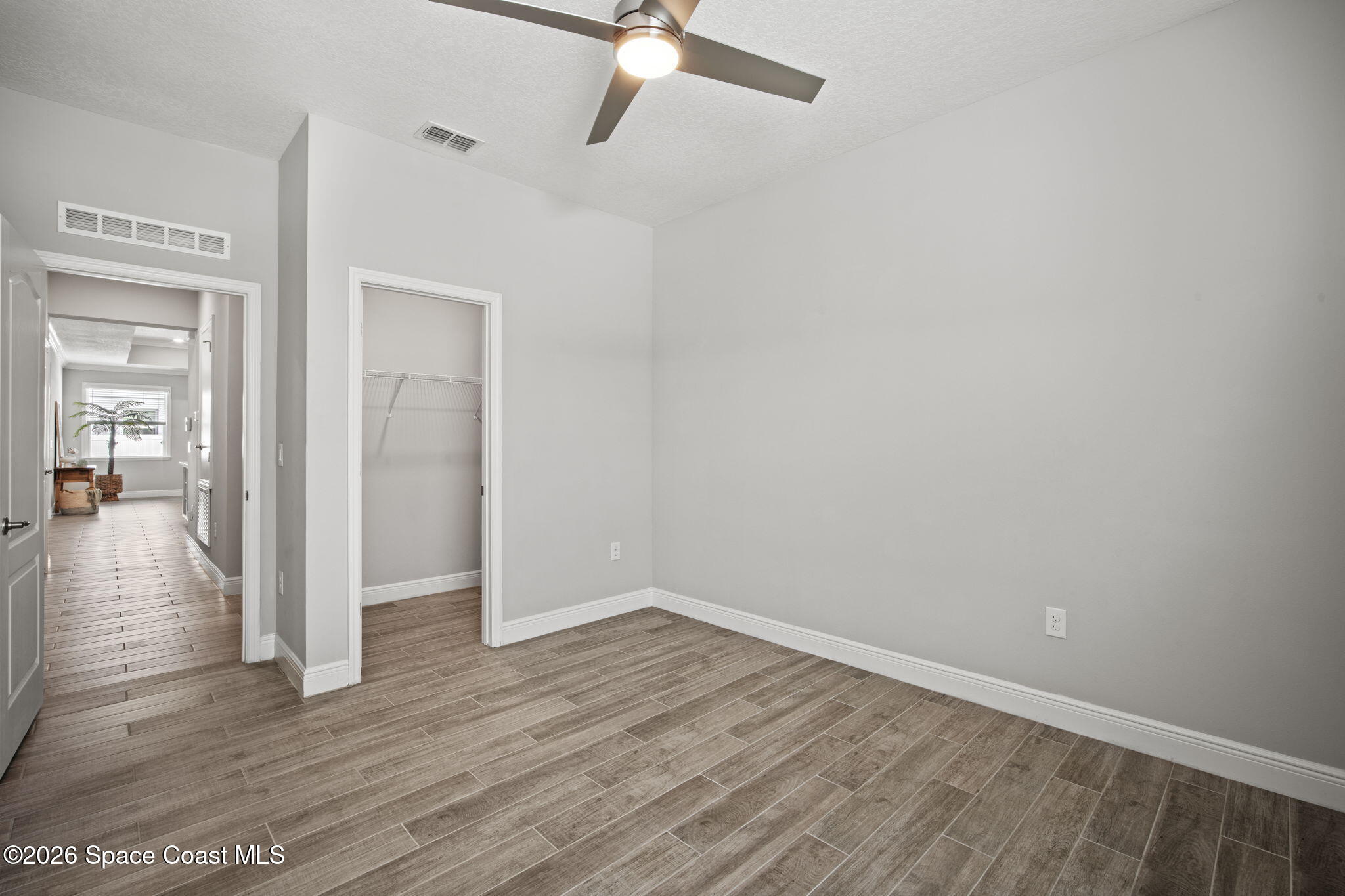4835 Hebron Drive Merritt Island, FL 32953 - Photo 40 of 53 a view of a room with wooden floor