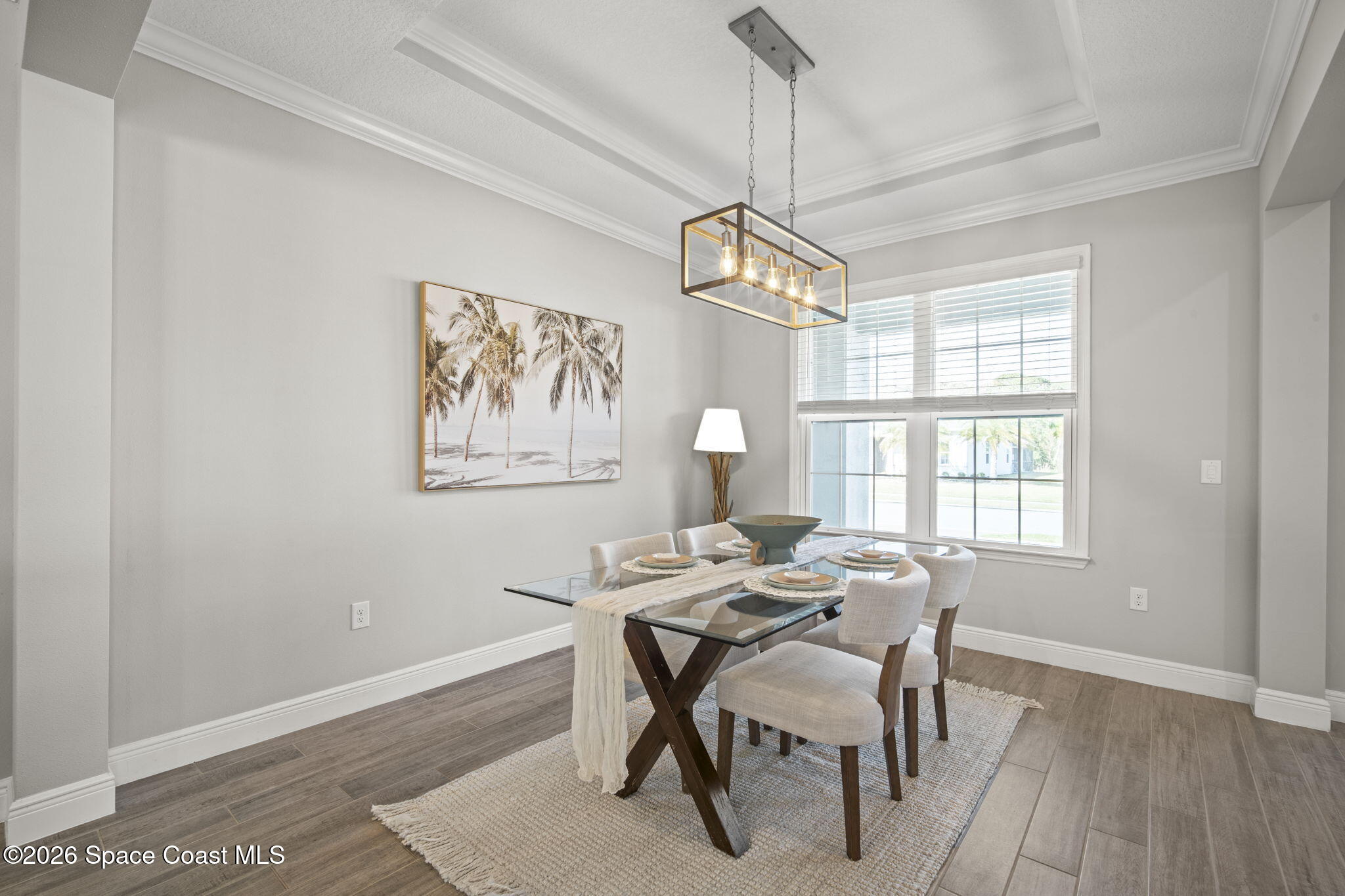 4835 Hebron Drive Merritt Island, FL 32953 - Photo 8 of 53 a view of a dining room with furniture window and wooden floor